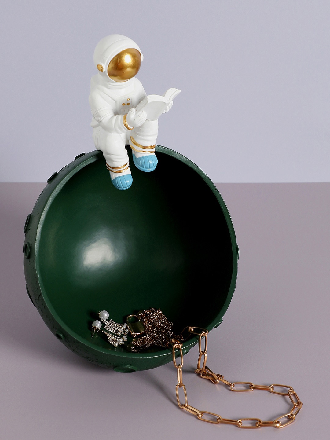 

Bonhomie Green & White Astronaut On Forest Mood Ceramic Showpiece