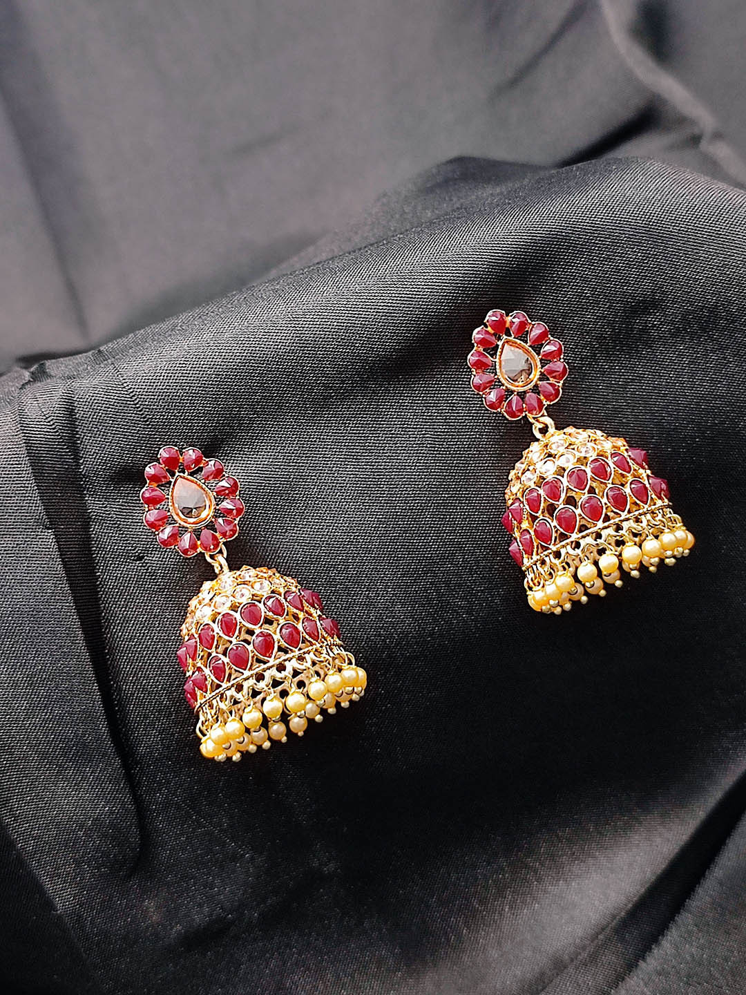

CRAYTON Women Gold Plated Dome Shaped Jhumkas Earrings, Maroon
