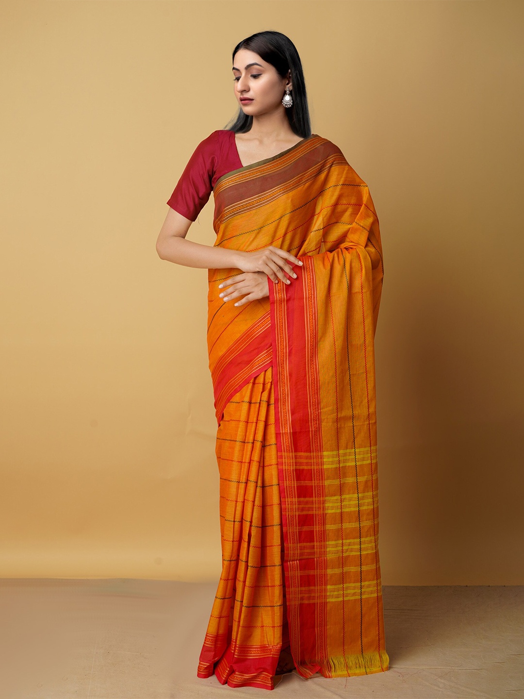 

Unnati Silks Orange & Maroon Checked Zari Pure Cotton Kanjeevaram Saree