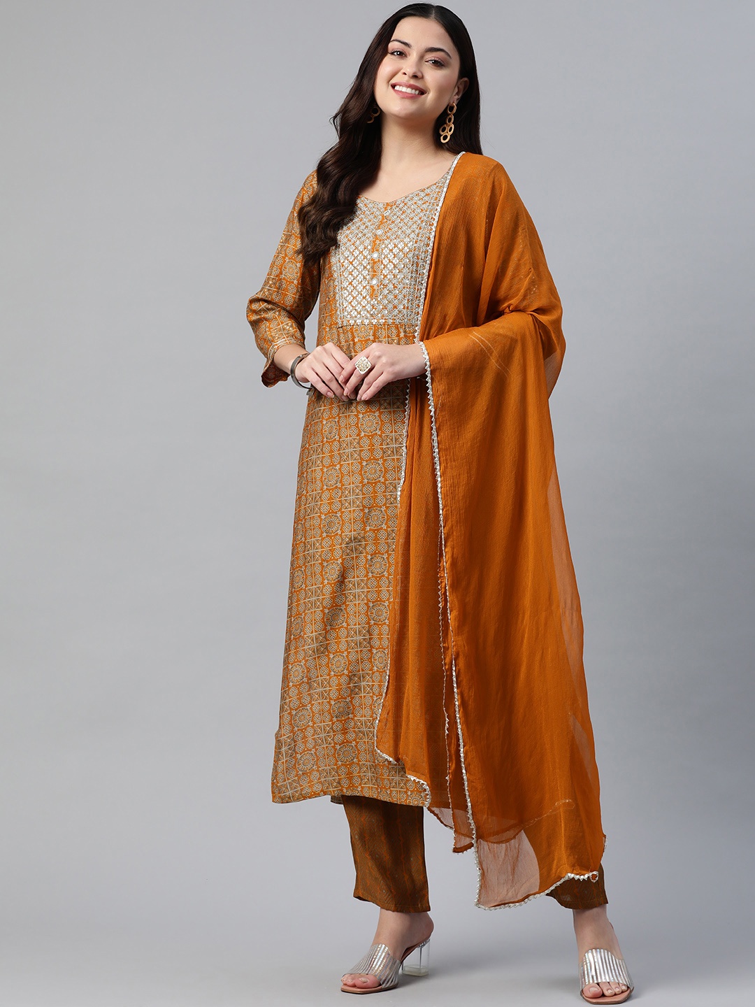 

Readiprint Fashions Women Floral Printed Sequinned Chanderi Kurta with Trousers & Dupatta, Rust