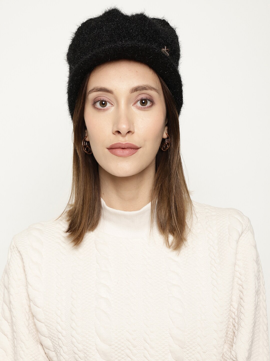 

Roadster Women Black Self-Design Winter Woolen Beanie