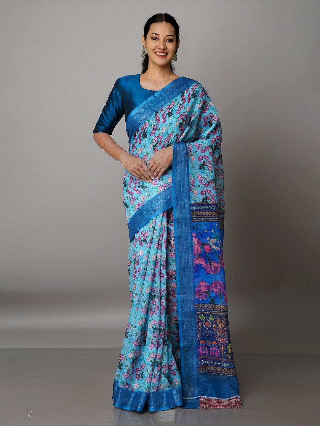 

Unnati Silks Blue & Silver-Toned Ethnic Motifs Zari Linen Blend Jamdani Saree