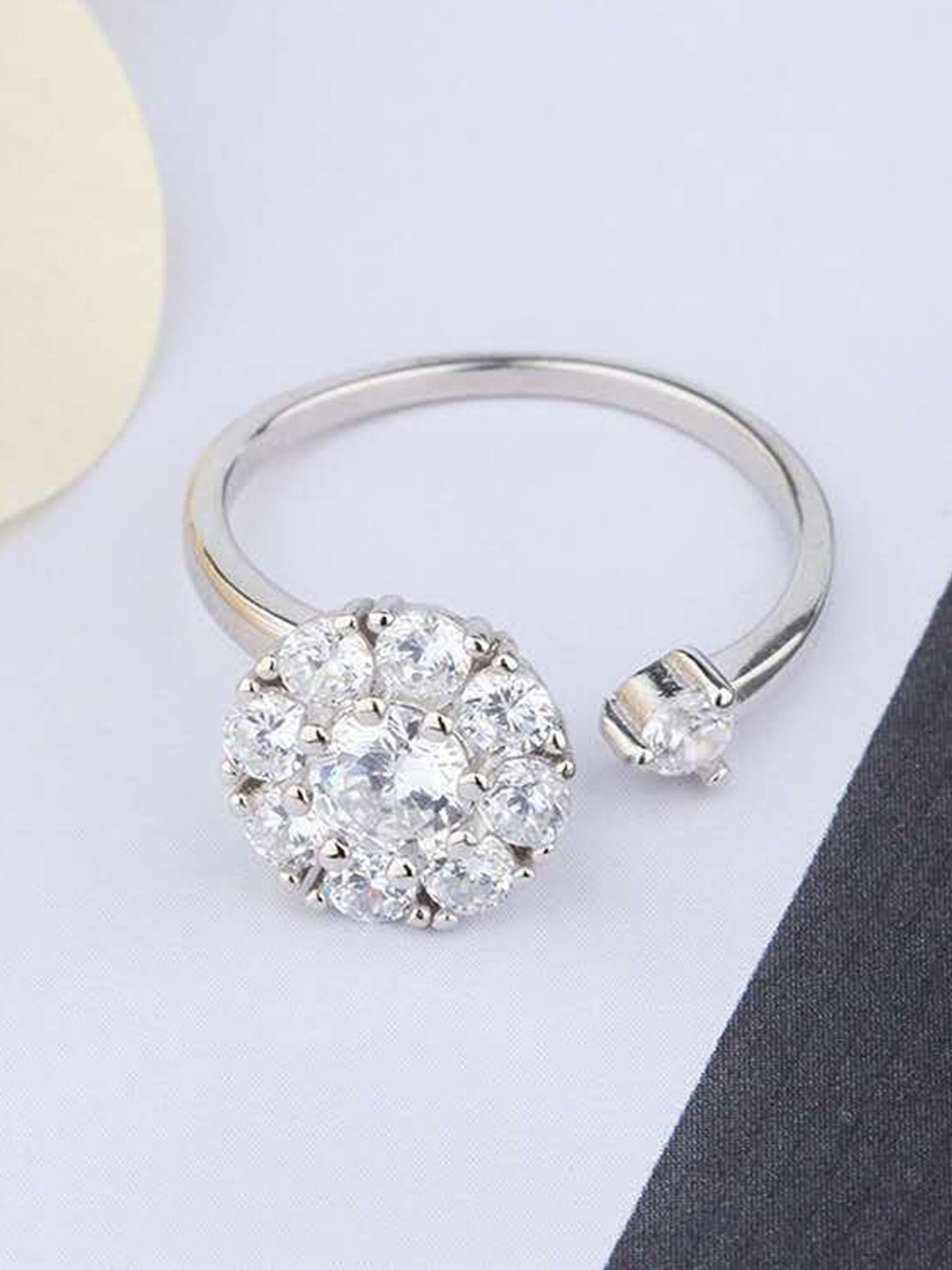 

Vembley Rotating Silver-Plated & White CZ Stone-Studded Adjustable Flower Finger Ring