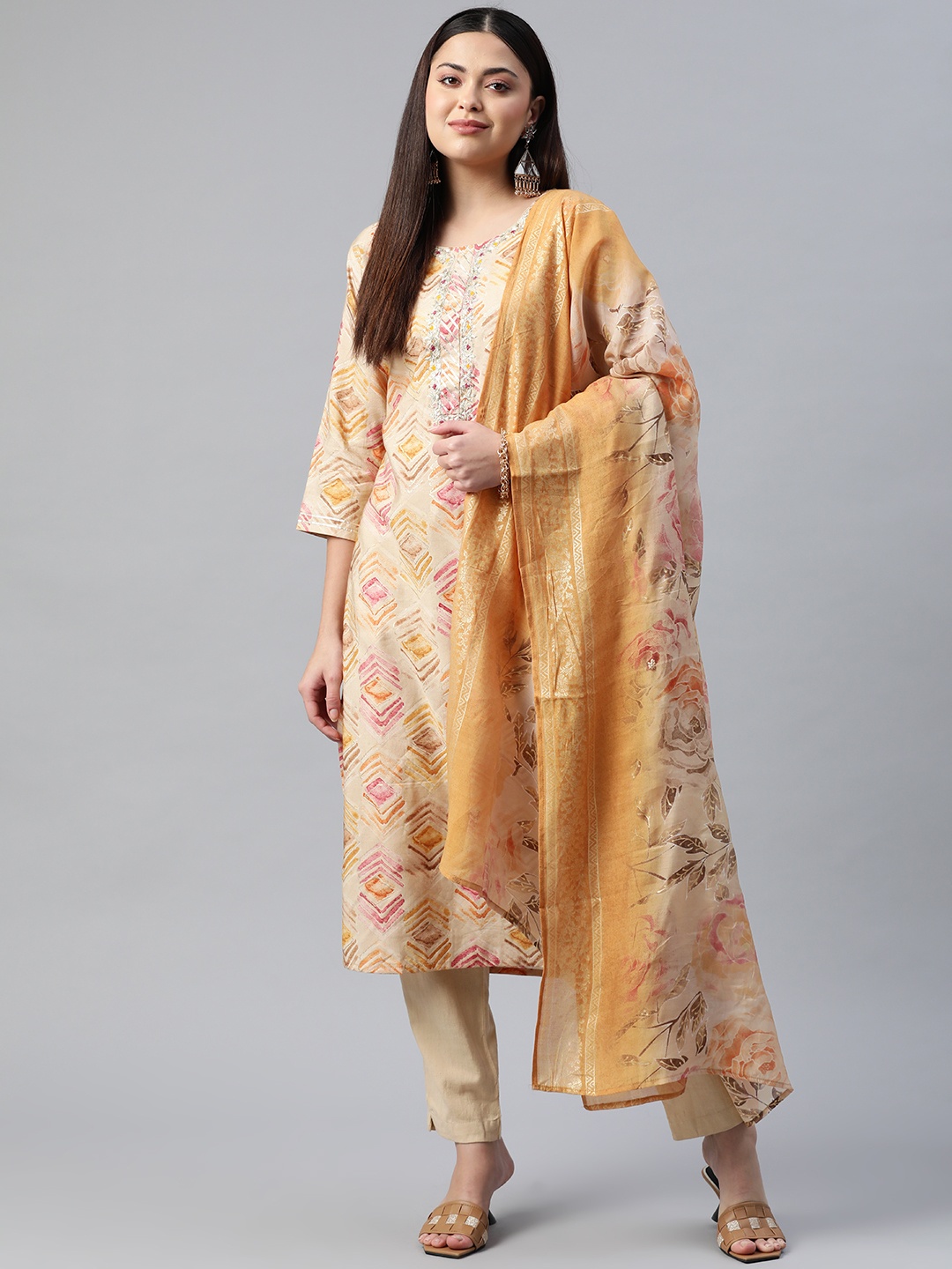 

Readiprint Fashions Women Beige Floral Printed Thread Work Pure Cotton Kurta Set