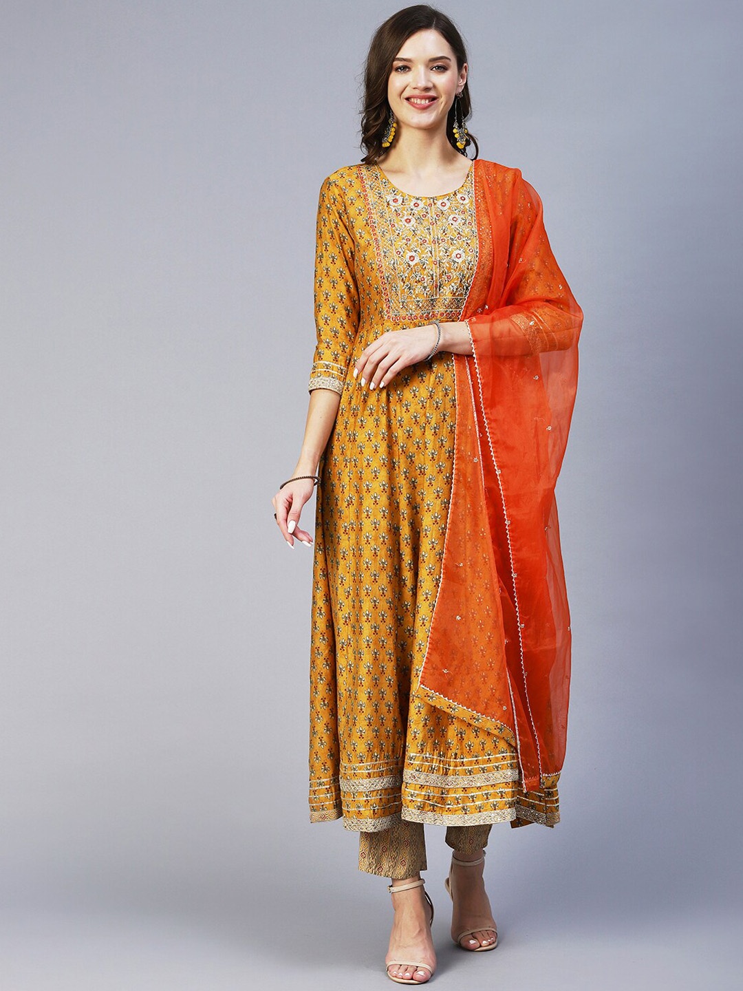 

FASHOR Floral Printed Empire Mirror Work Kurta with Trousers & With Dupatta, Mustard