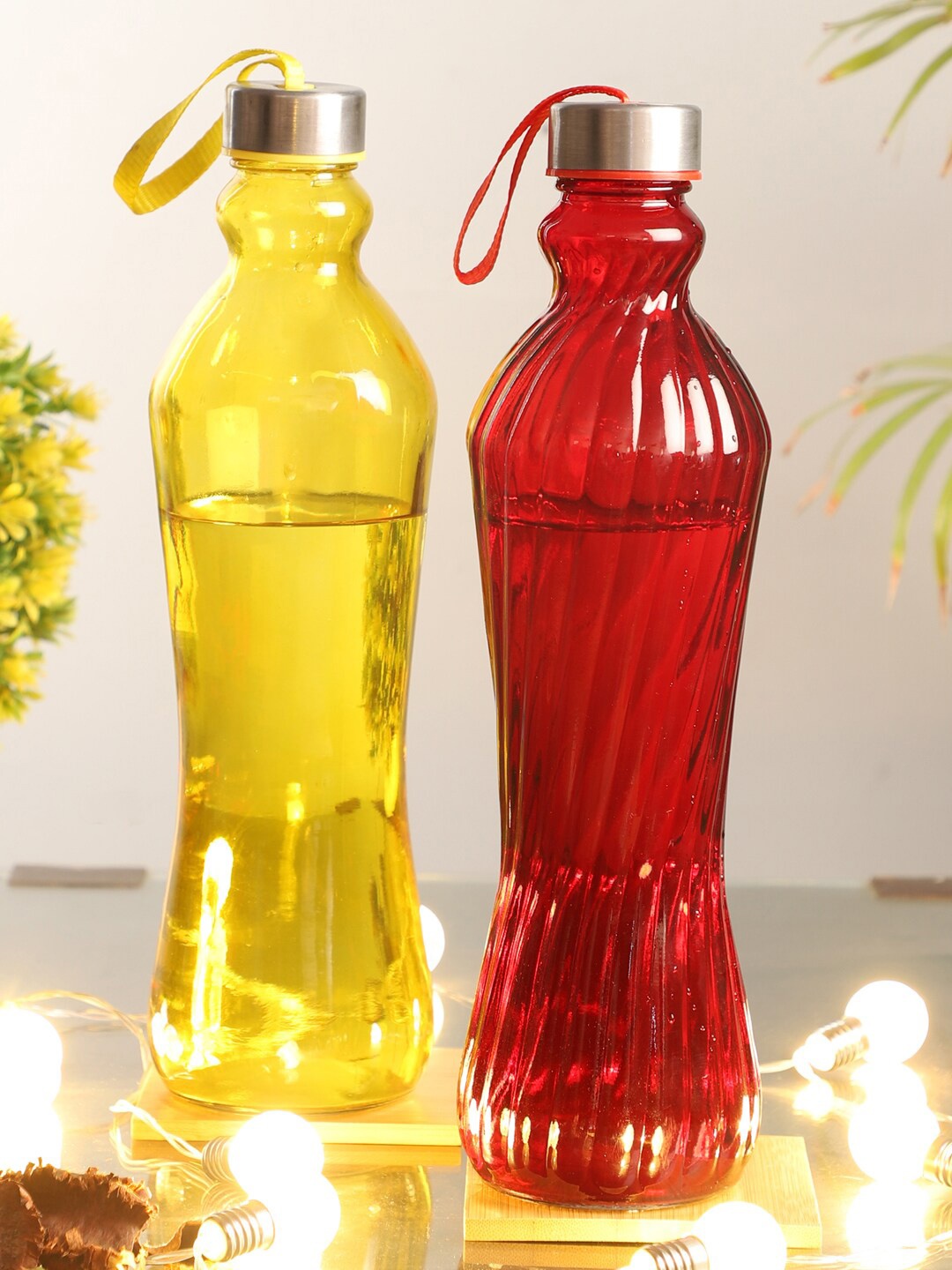 

ceradeco Set Of 2 Yellow & Red Textured Plain and Spiral Glass Water Bottles-1Ltr