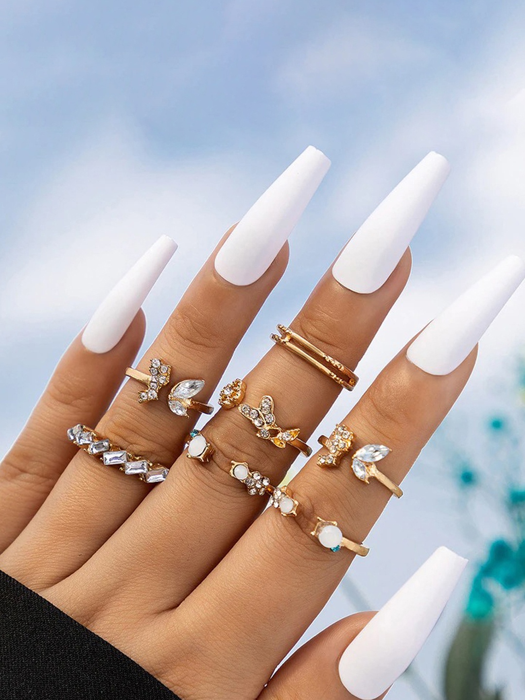 

Jewels Galaxy Set of 7 Gold-Plated Stone Studded Contemporary Stackable Finger Rings