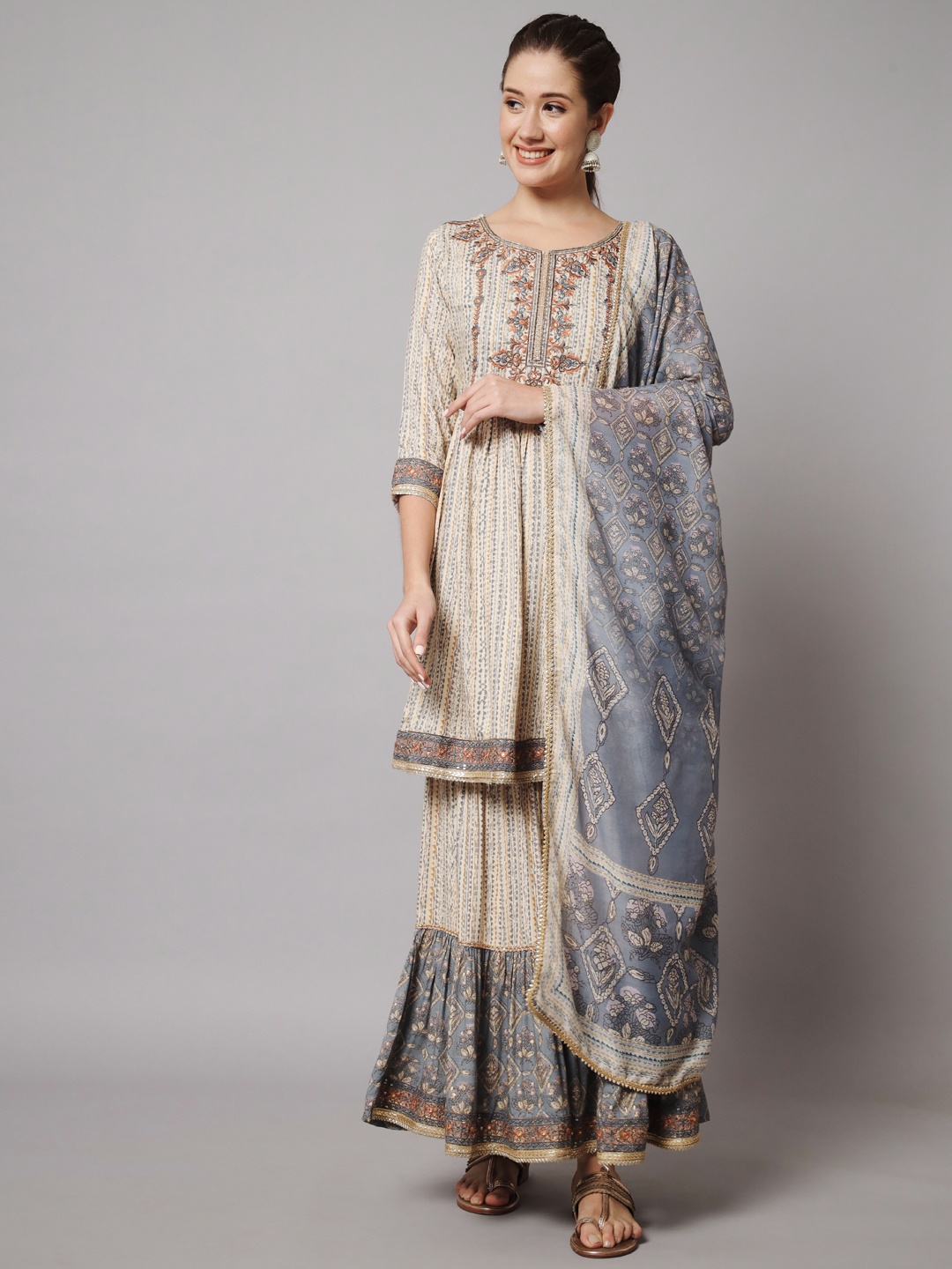 

Nehamta Women Ethnic Motifs Embroidered Mirror Work Kurta with Sharara & With Dupatta, Cream
