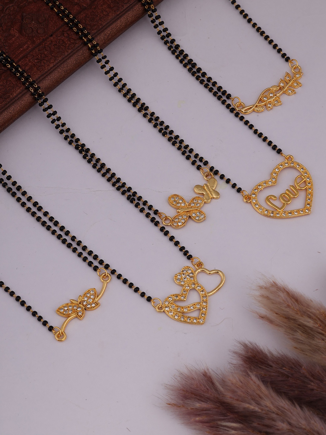 

Brado Jewellery Set Of 5 Gold-Plated & AD Studded & Beaded Mangalsutra