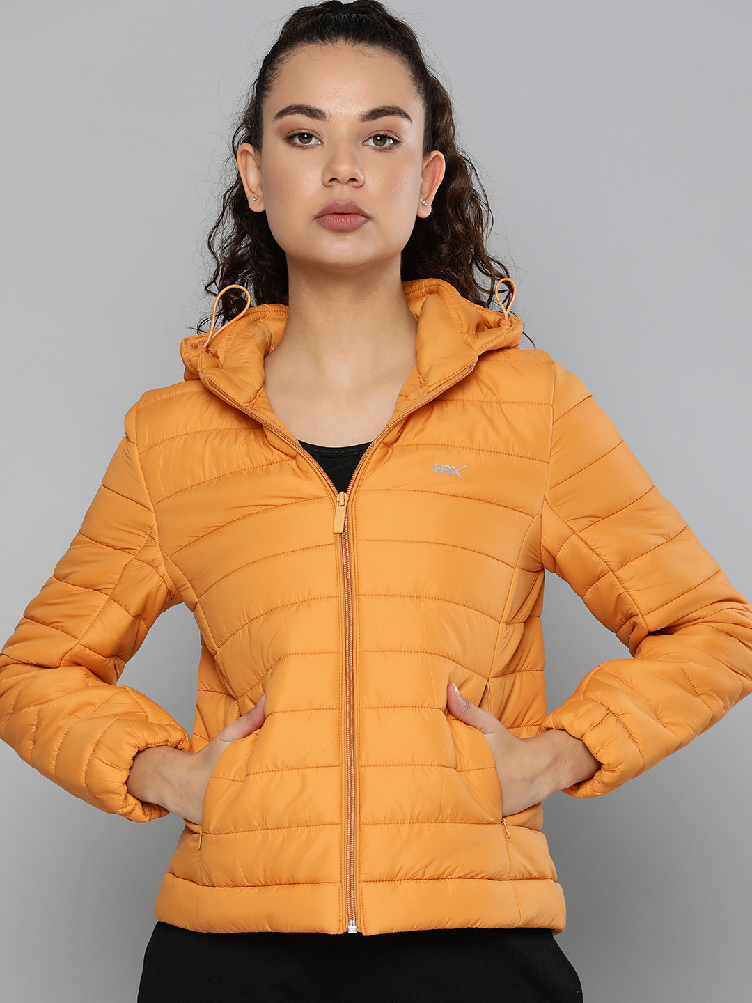 

HRX by Hrithik Roshan Women Solid Lightweight Padded Jacket, Mustard
