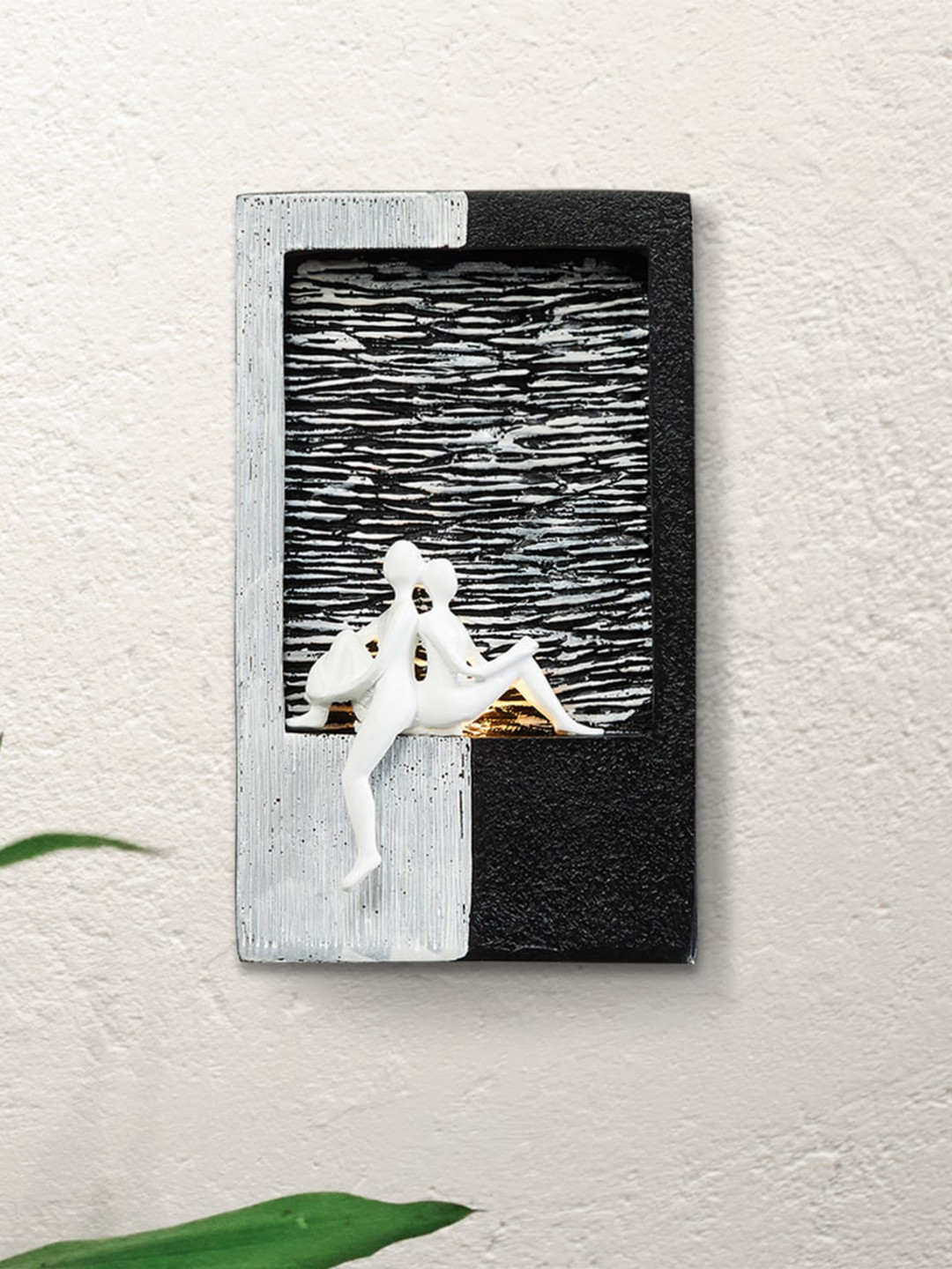 

Home Centre Black & White Textured Couple Polyresin Wall Fountain