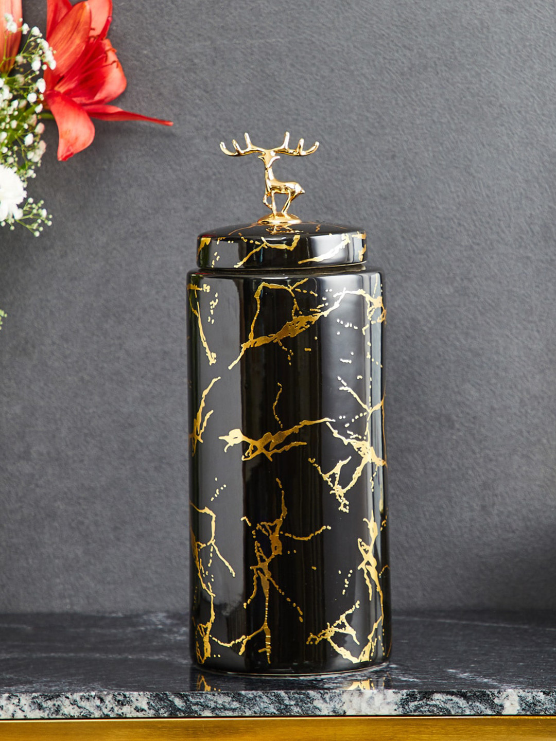 

Home Centre Black Printed Cylindrical Ceramic Canister with Reindeer on Top