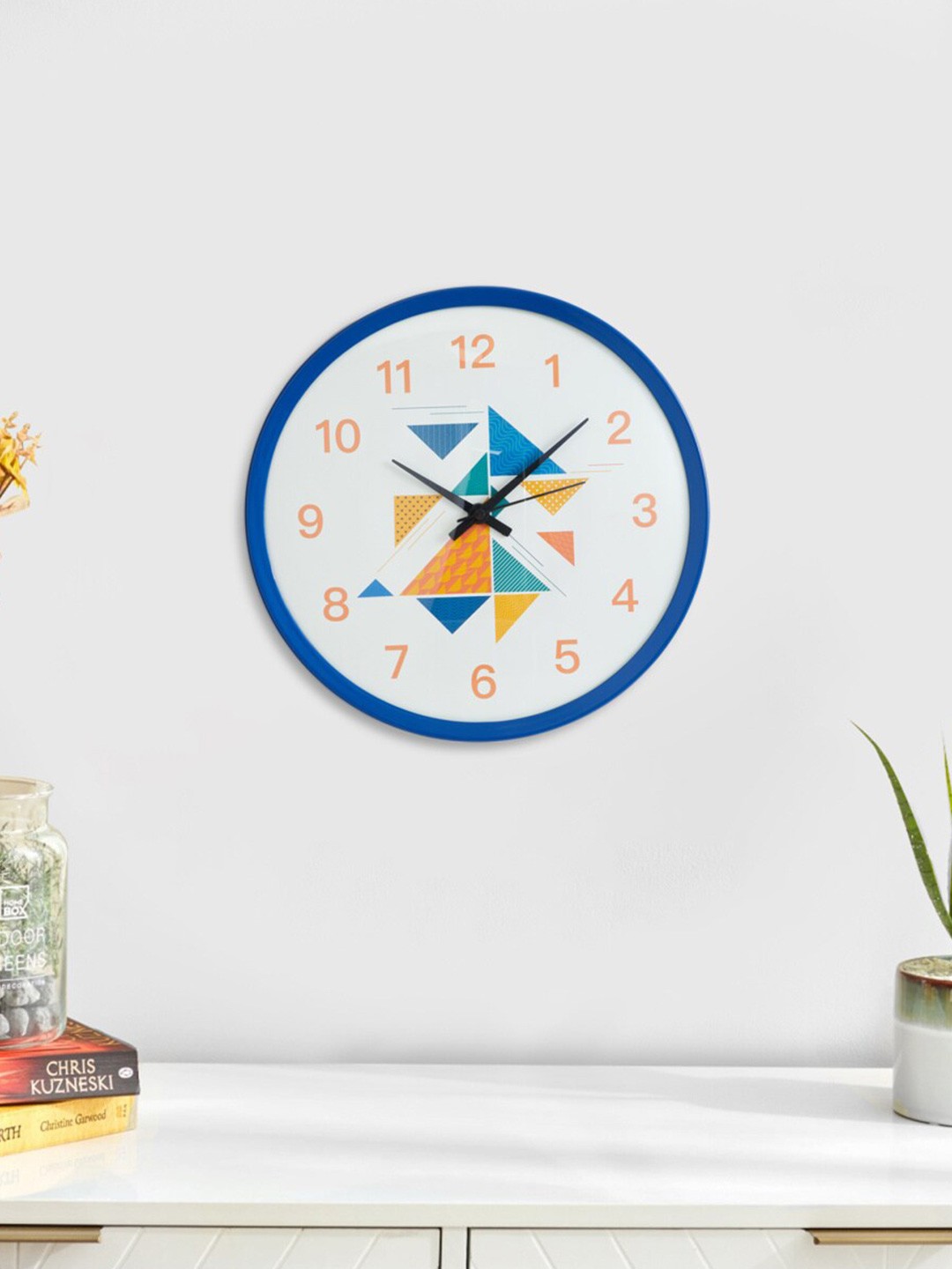 

Home Centre Corsica Irwin Blue & White Geometric Printed Contemporary Wall Clock