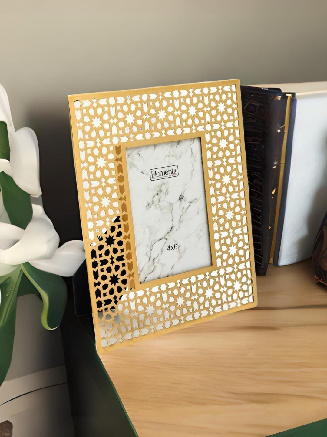 

Athome by Nilkamal Gold Toned Cutwork Glass Photo Frame