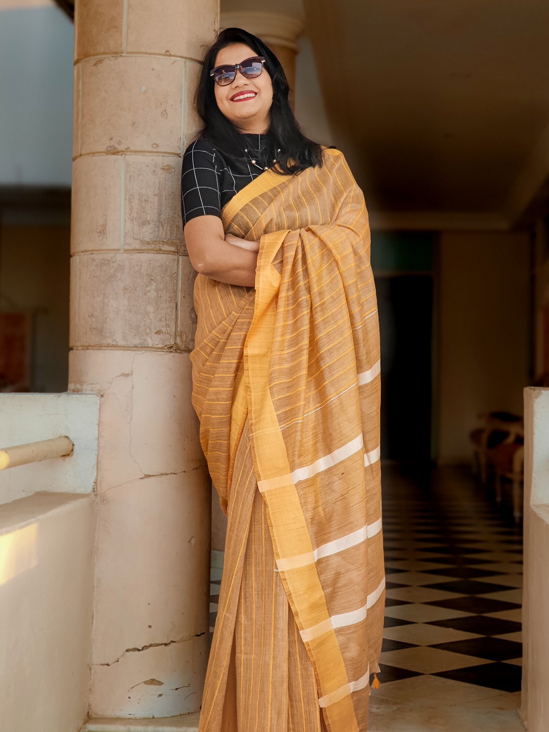 

Apaapi Threads of glory Yellow & White Striped Saree