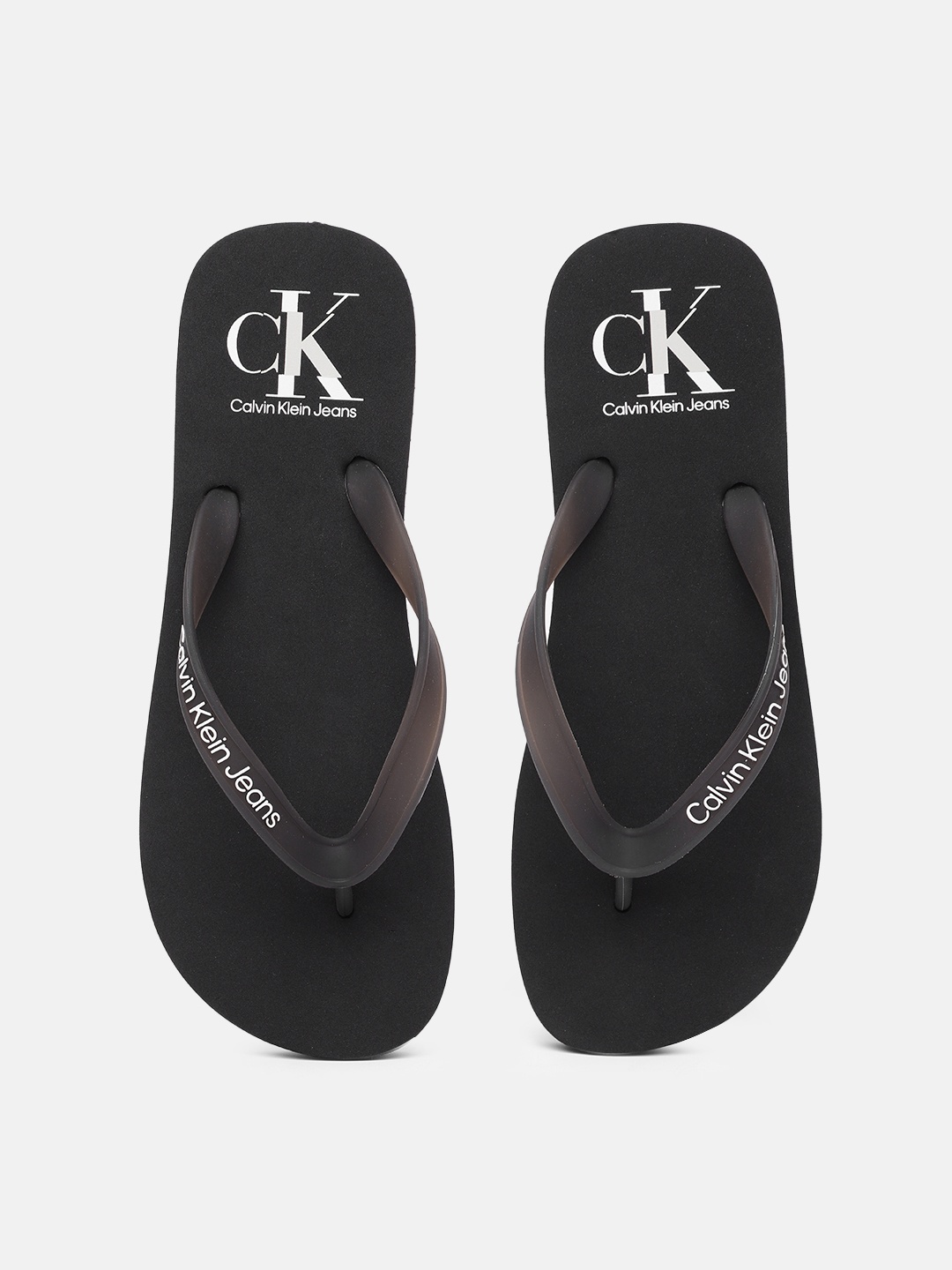 

Calvin Klein Jeans Men Brand Logo Print Thong Flip-Flops, Black