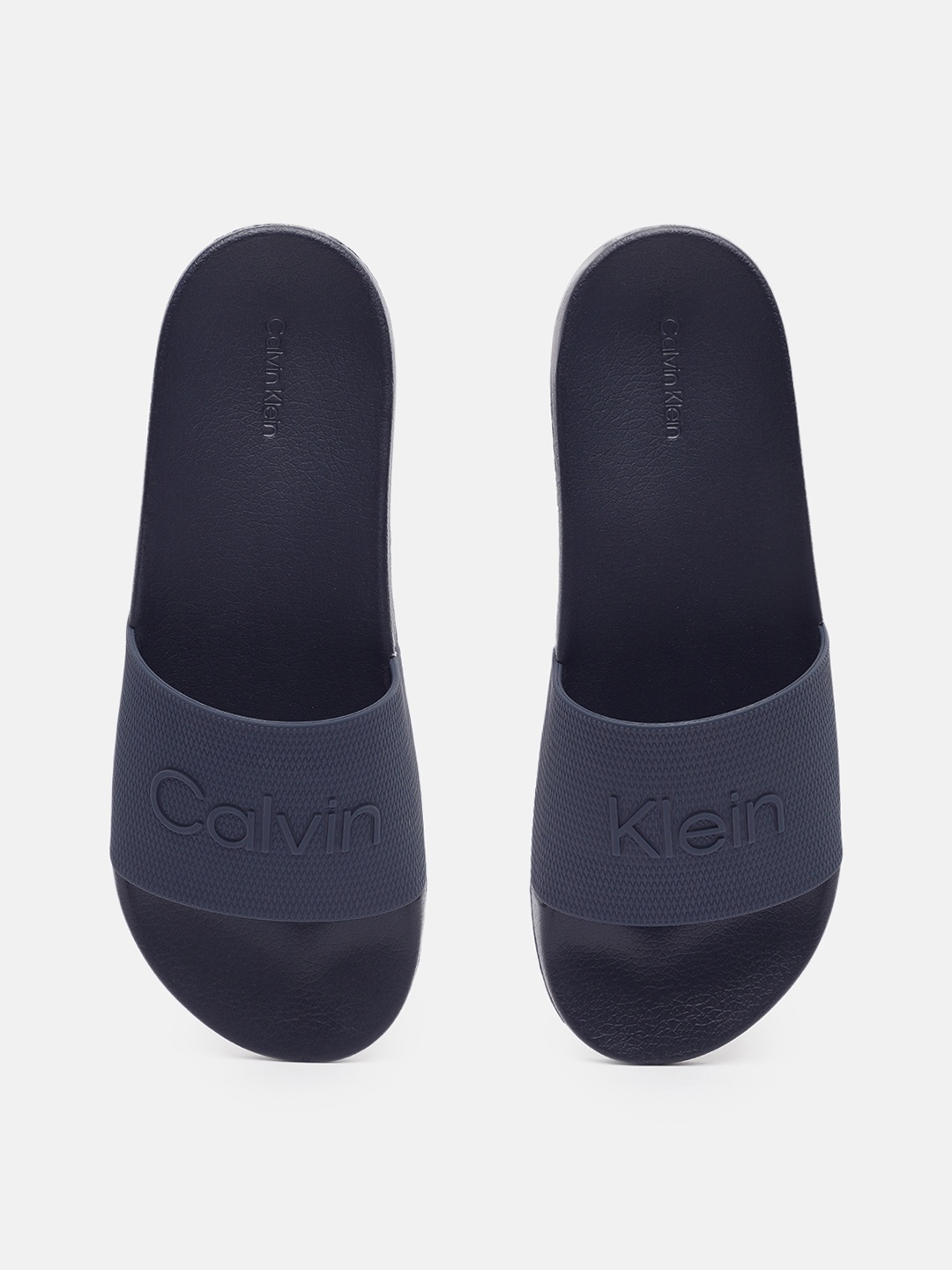 

Calvin Klein Jeans Men Brand Logo Printed Sliders, Navy blue
