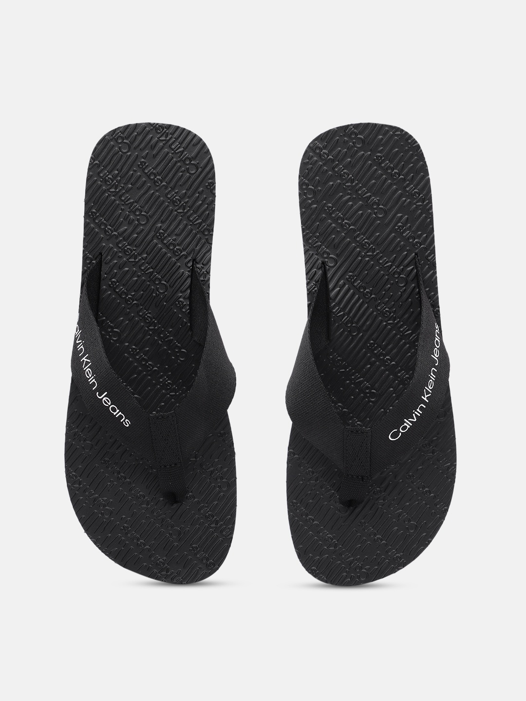 

Calvin Klein Jeans Men Brand Logo Print Thong Flip-Flops, Black