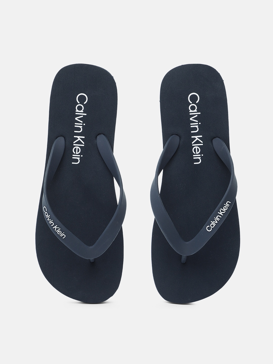 

Calvin Klein Jeans Men Brand Logo Print Thong Flip-Flops, Navy blue