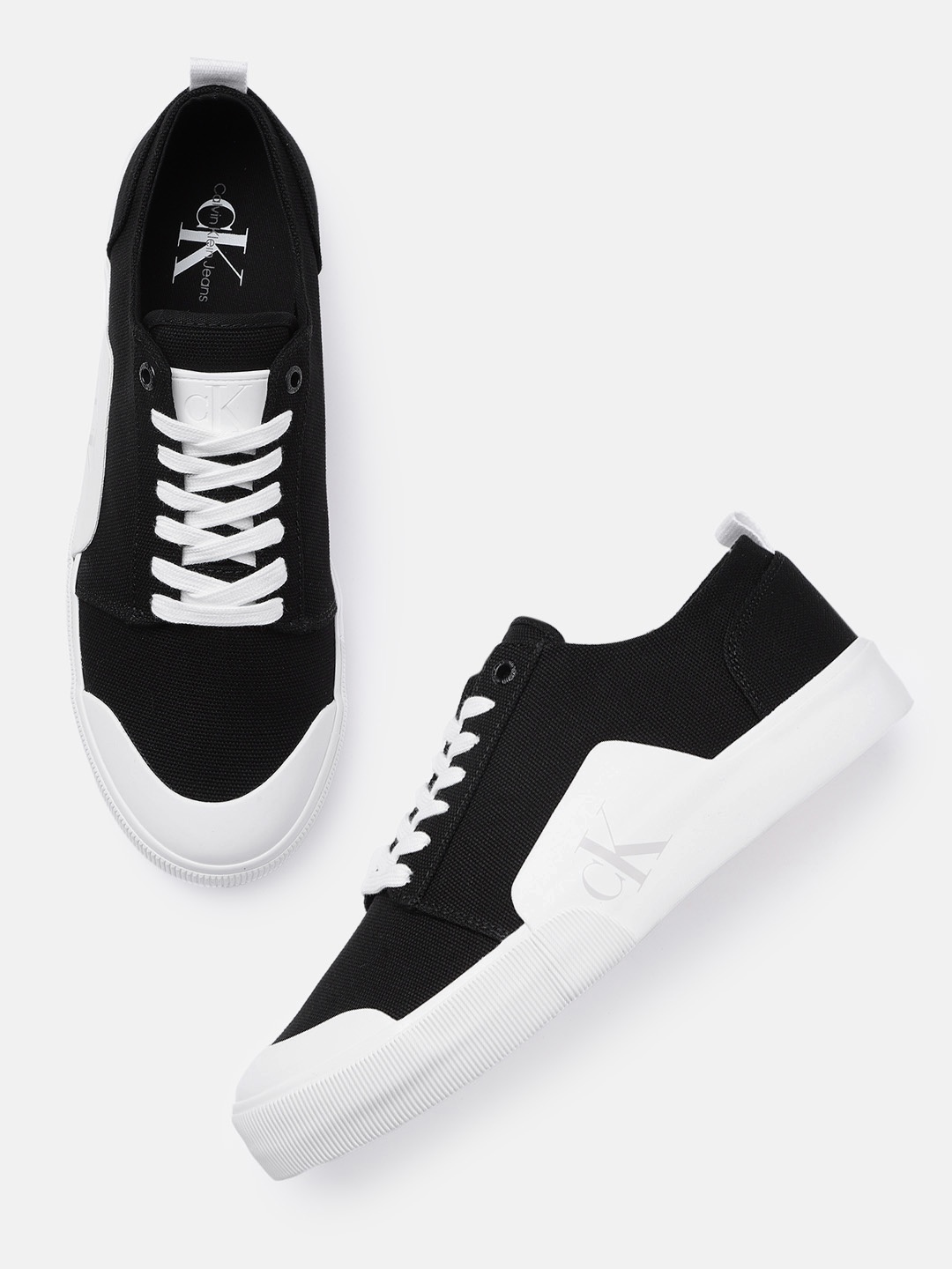 

Calvin Klein Jeans Men Solid Regular Canvas Sneakers With Minimal Brand Logo Print Detail, Black
