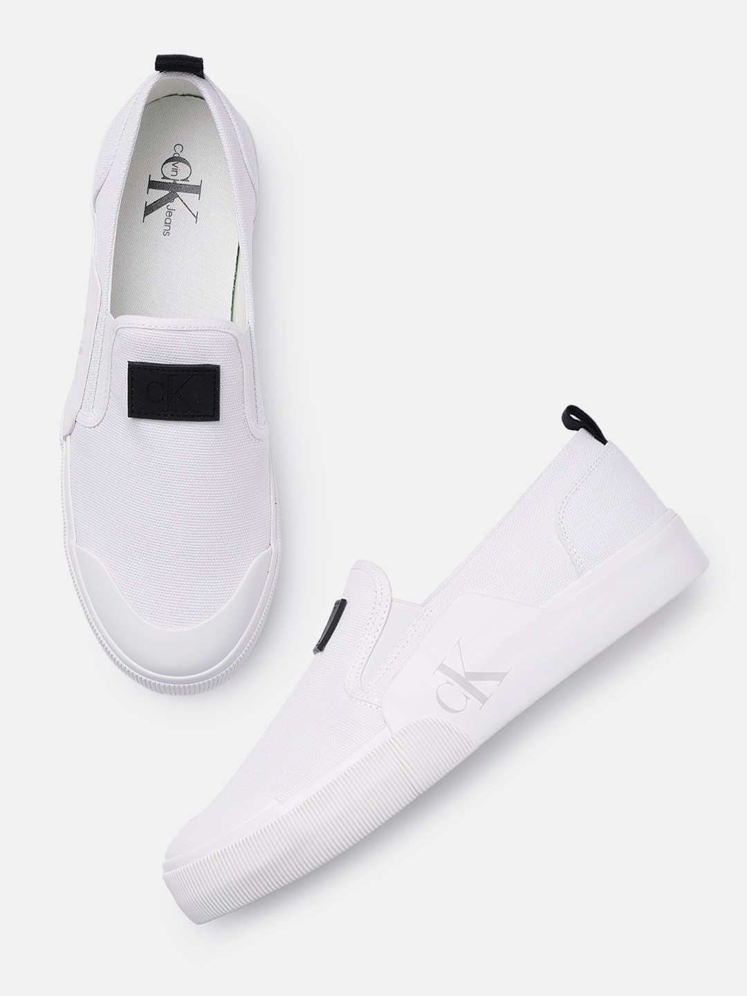 

Calvin Klein Jeans Men Solid Canvas Slip-On Sneakers With Brand Logo Applique Detail, White