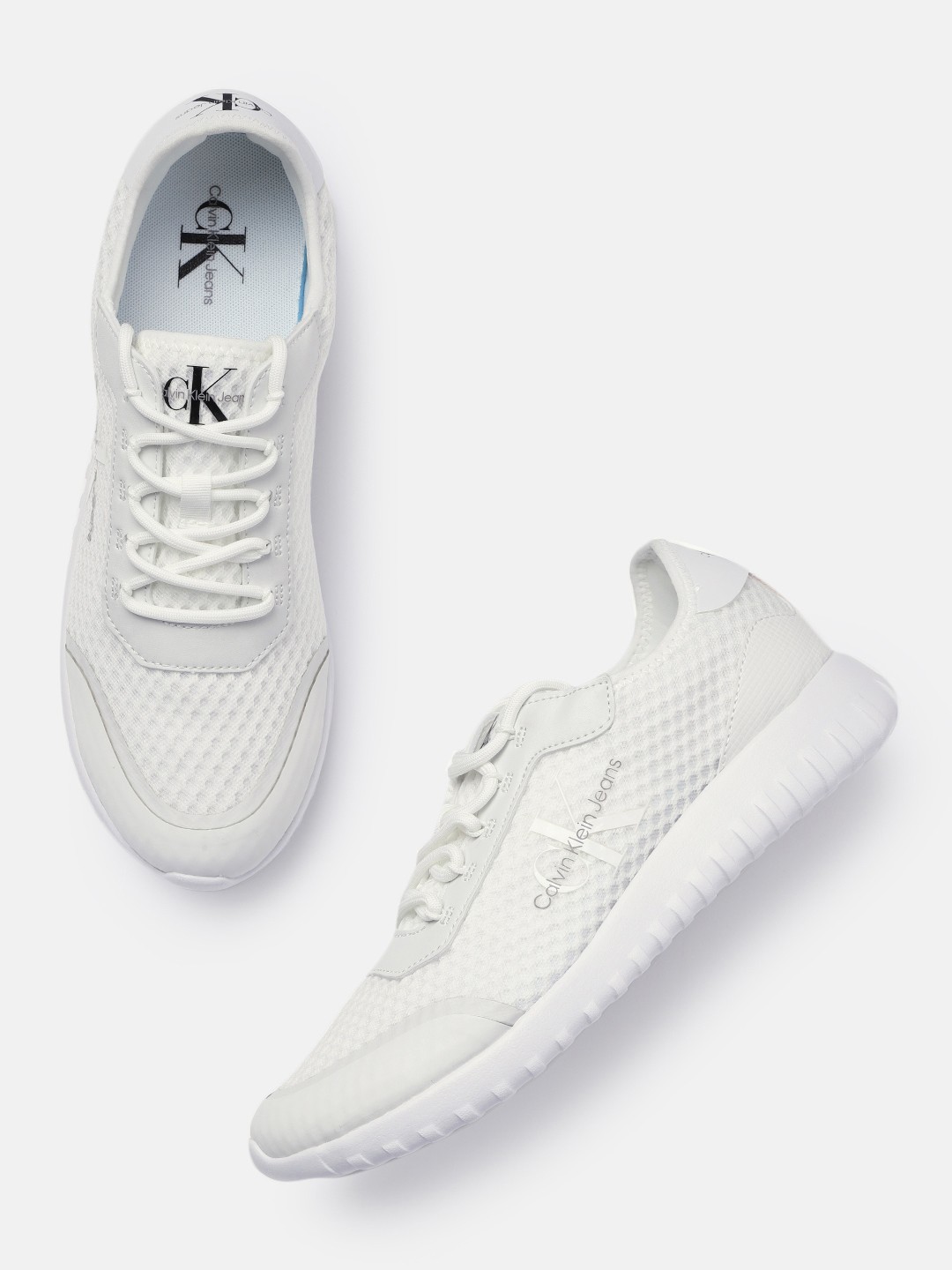 

Calvin Klein Jeans Men Solid Sneakers, White