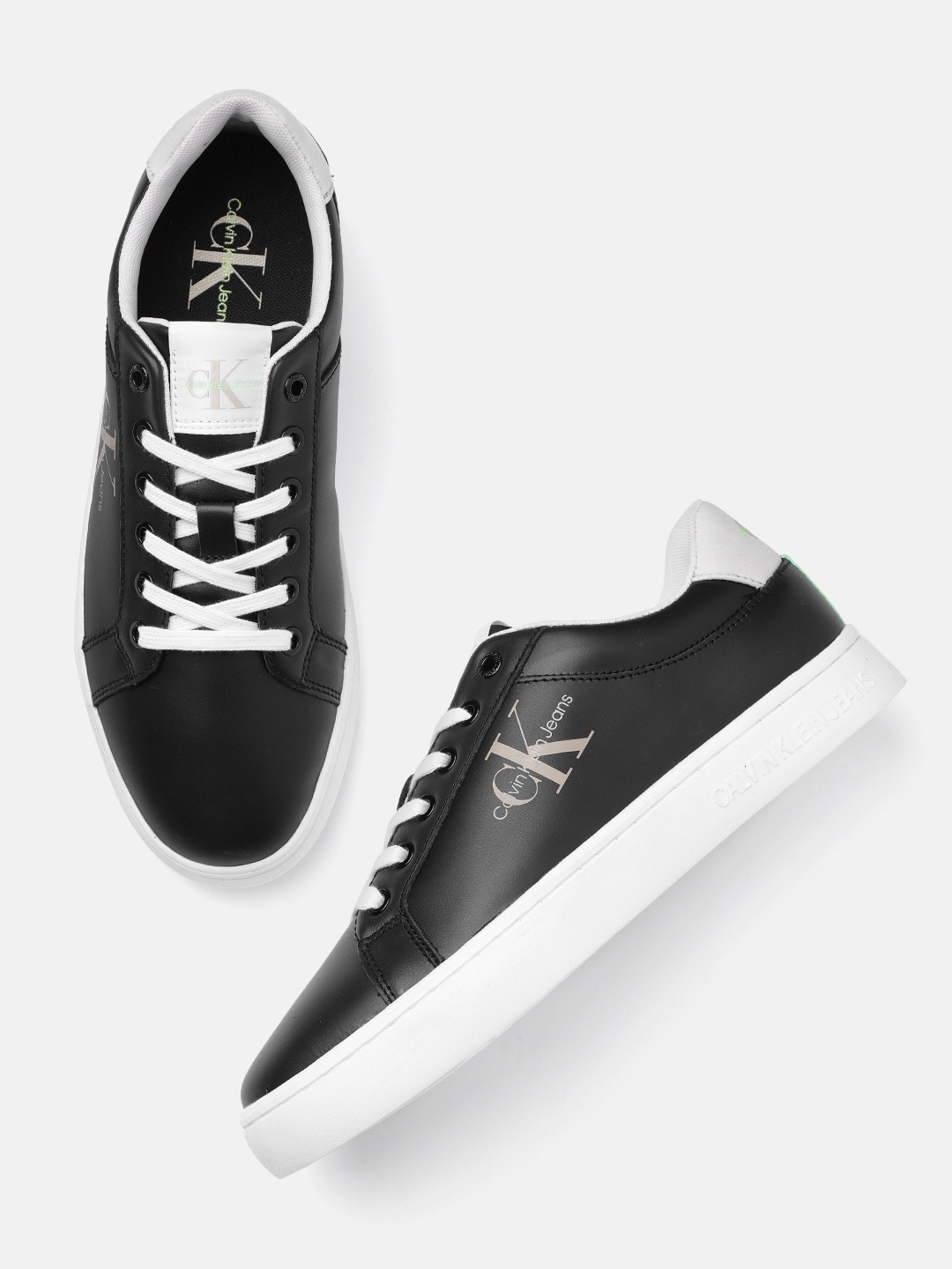 

Calvin Klein Jeans Men Solid Leather Sneakers With Minimal Brand Logo Print Detail, Black