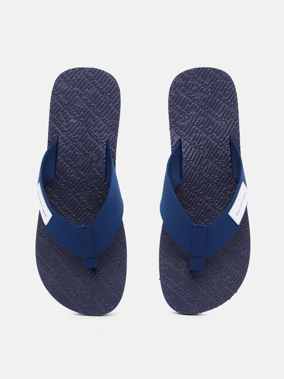 

Calvin Klein Jeans Men Solid Thong Flip-Flops With Brand Logo Applique Detail, Blue