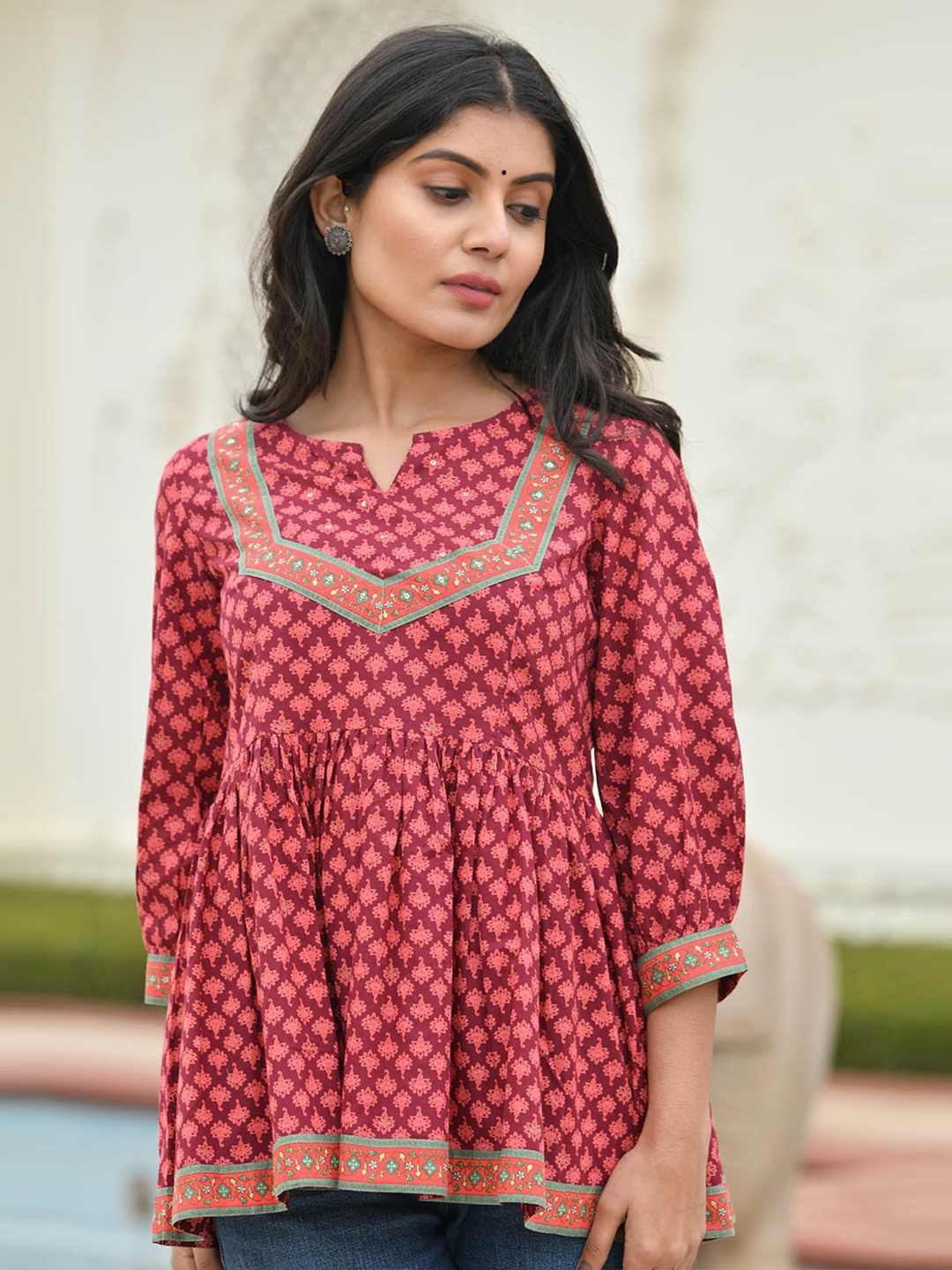 

Aaheli Maroon Geometric Print Peplum Top