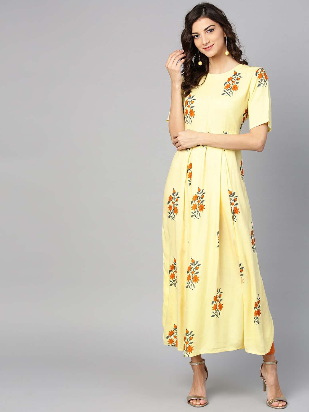 

Ives Women Floral Printed Round Neck A-Line Kurta, Yellow