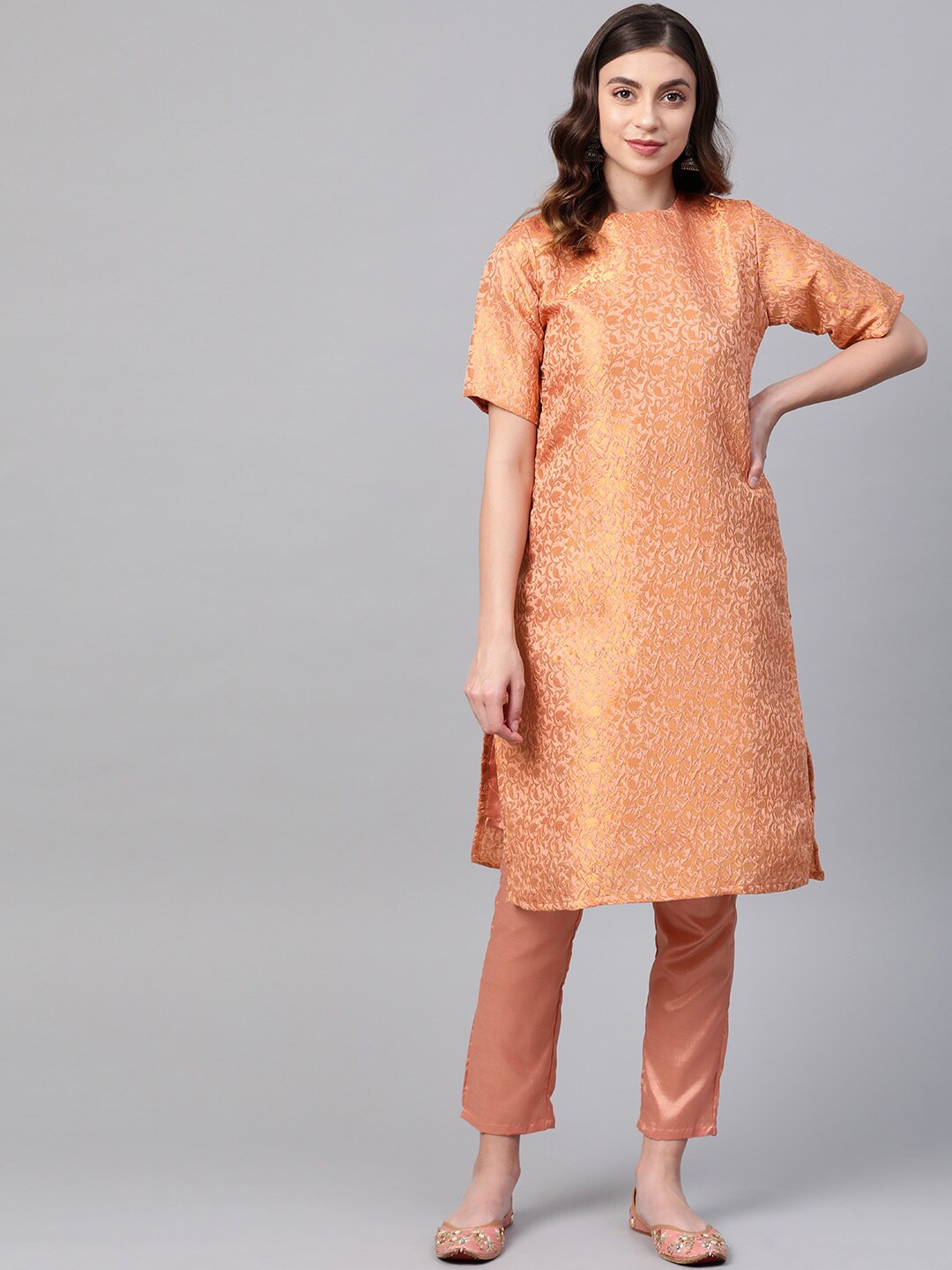 

Ives Women Peach Ethnic Motifs Kurta with Trousers