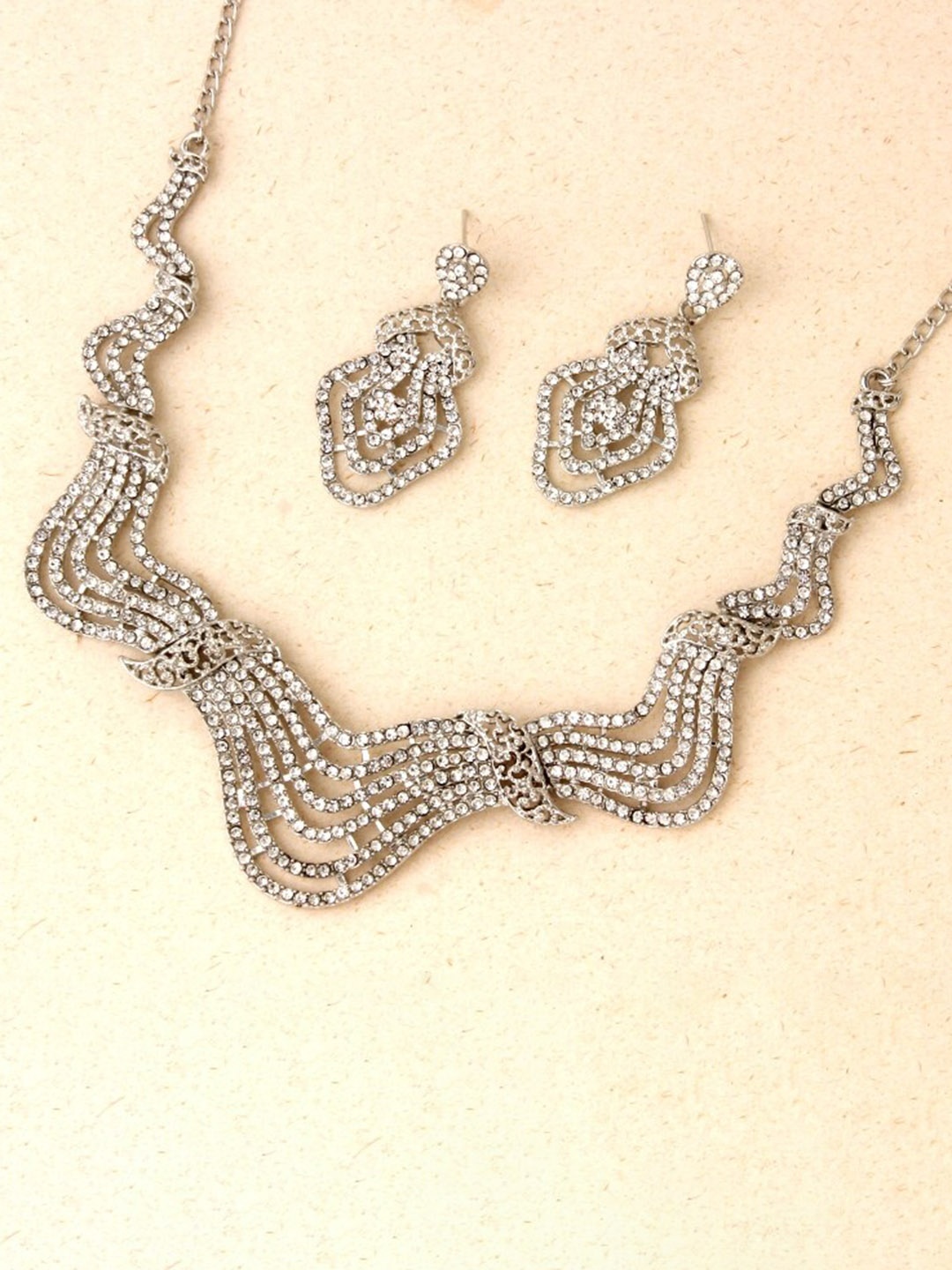 

Atasi International Silver-Plated Crystals-Studded Jewellery Set