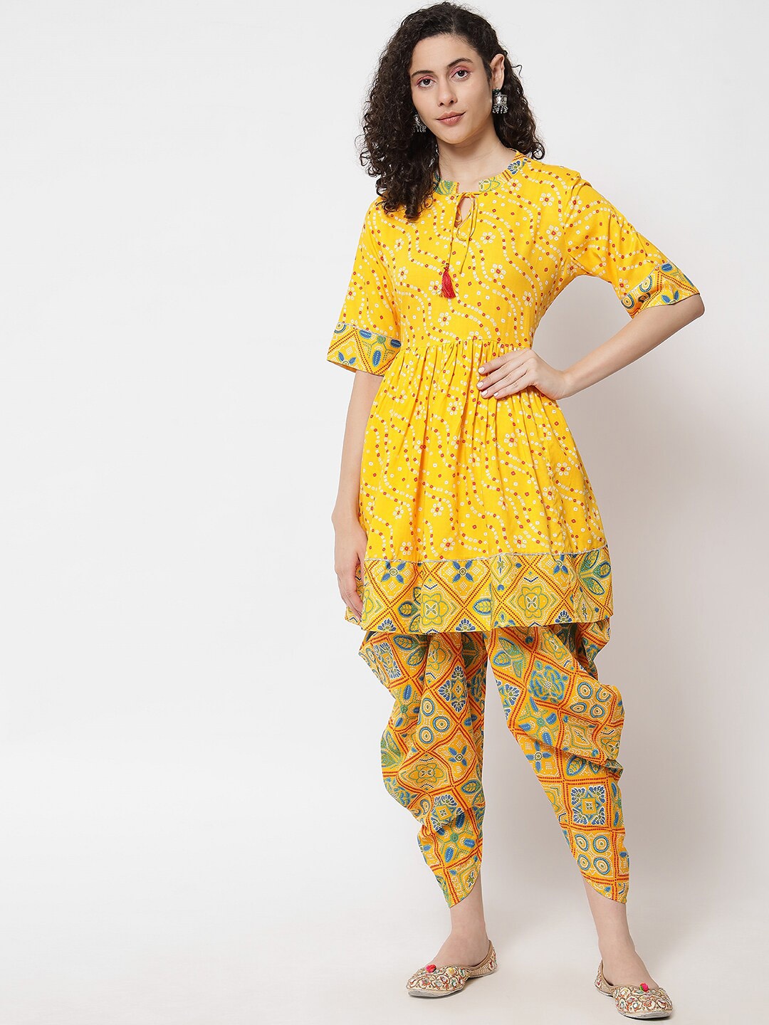 

Meeranshi Women Floral Printed Gotta Patti Kurta with Dhoti Pants, Yellow