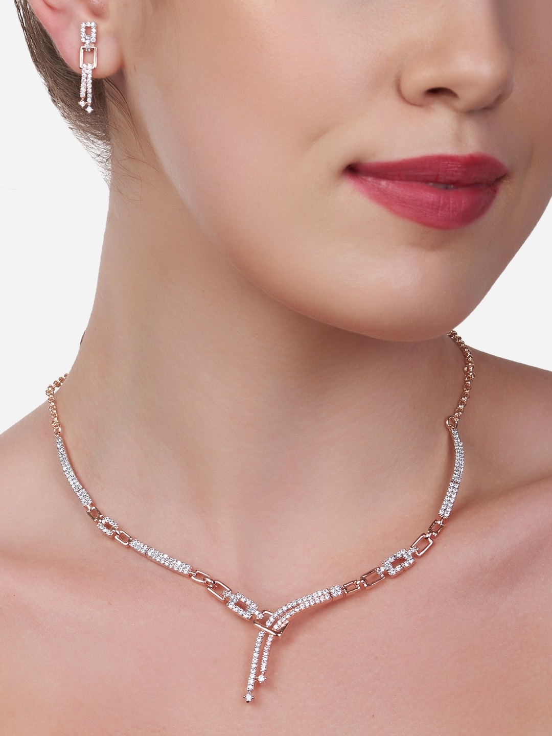 

Zaveri Pearls Women Rose Gold-Plated Cubic Zirconia Stone Studded Jewellery Set