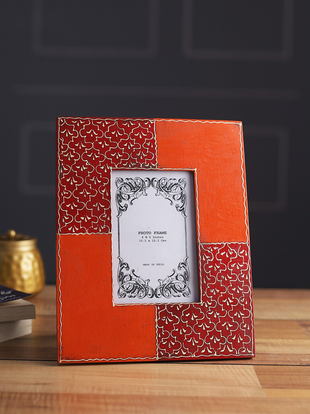 

Aapno Rajasthan Orange Colored & Red Printed Wooden Table Photo Frame