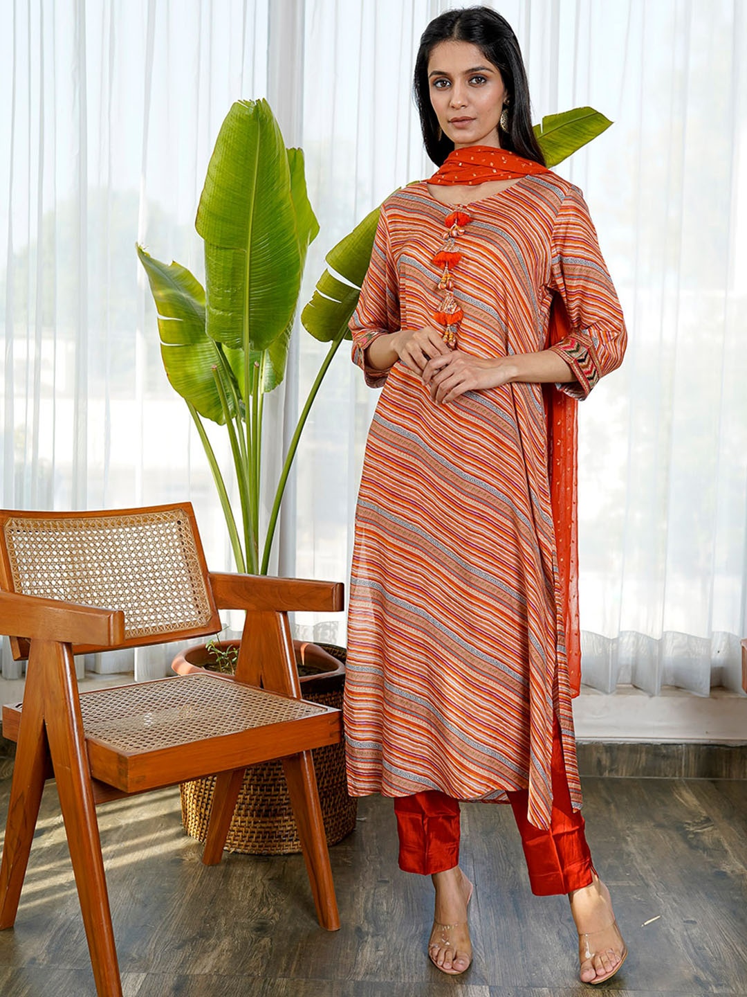 

KAMODINEE Women Orange Leheriya Printed Kurta with Trousers & With Dupatta