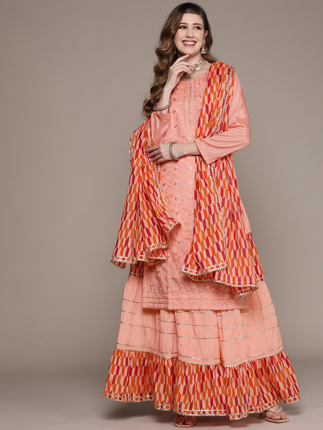

Ishin Women Ethnic Motifs Embroidered Sequinned Kurta with Skirt & With Dupatta, Peach