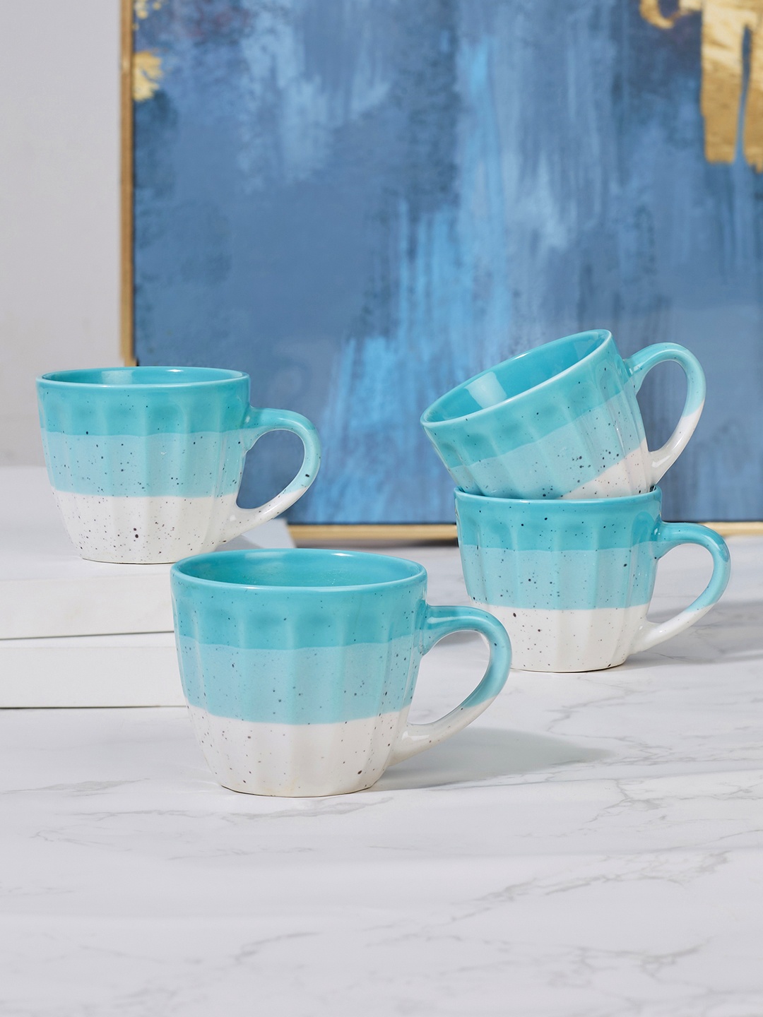 

HomeTown Emilia Blue & Off White Set of 4 Printed Ceramic Glossy Mugs 100 ml