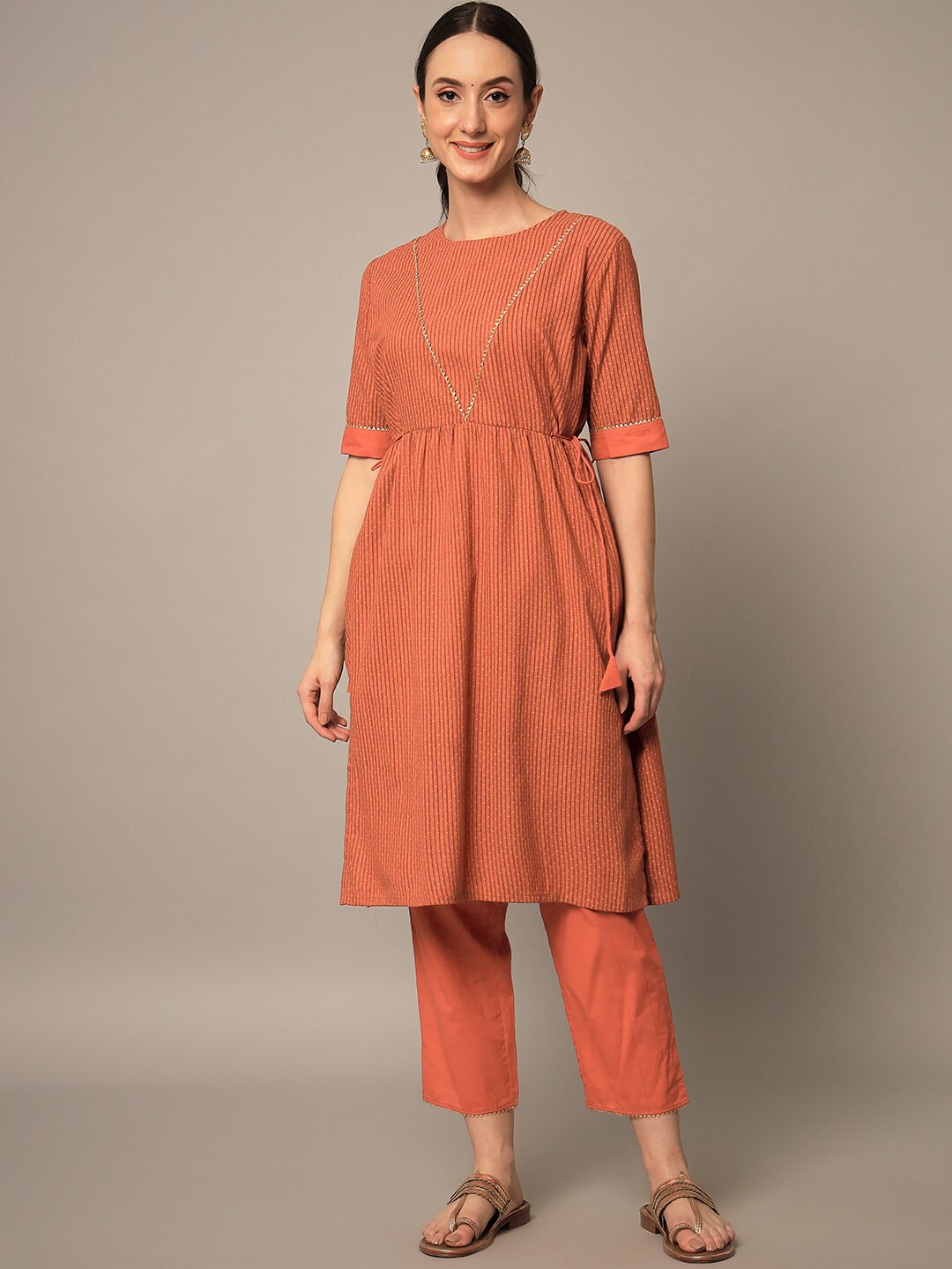 

Yaadleen Women Striped Pleated Pure Cotton Kurta with Trousers, Orange