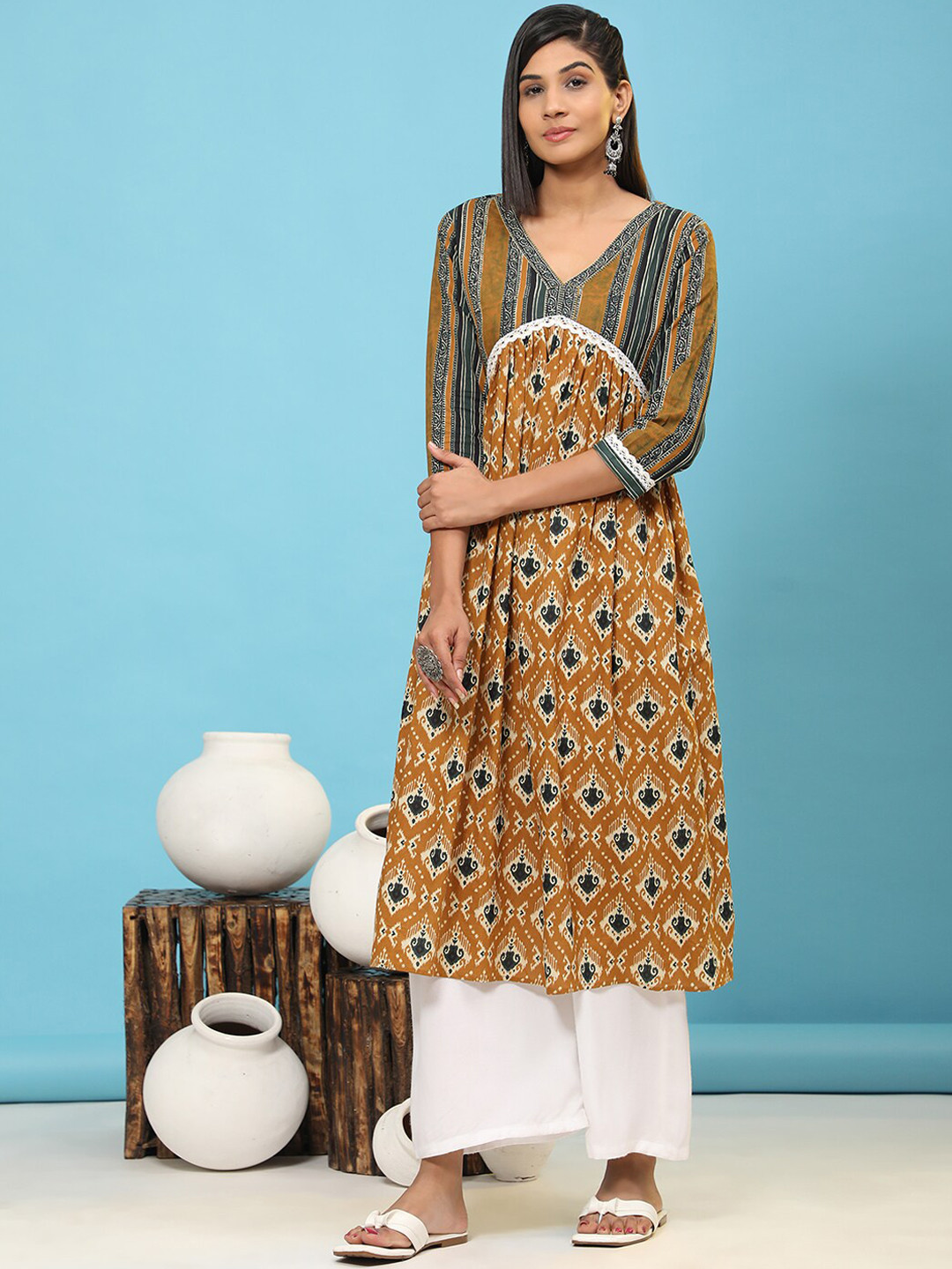 

Vbuyz Ethnic Motifs Printed Empire Pure Cotton Kurta, Mustard