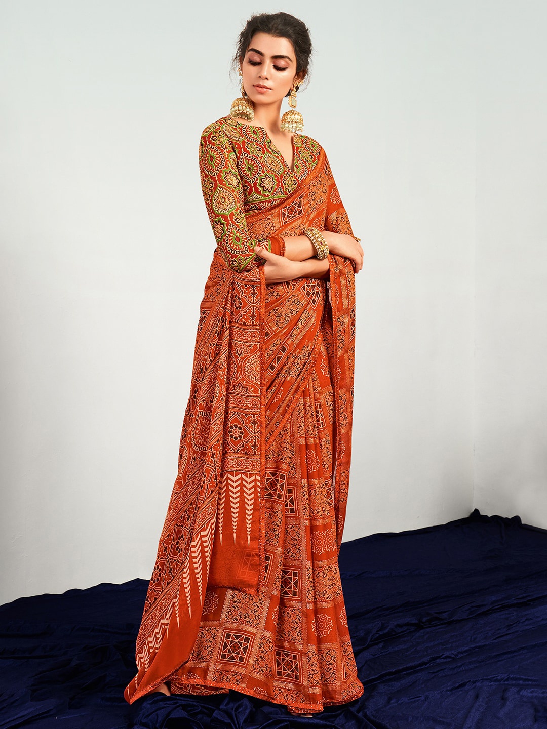 

Saree mall Ethnic Motifs Zari Pure Georgette Patola Sarees, Orange