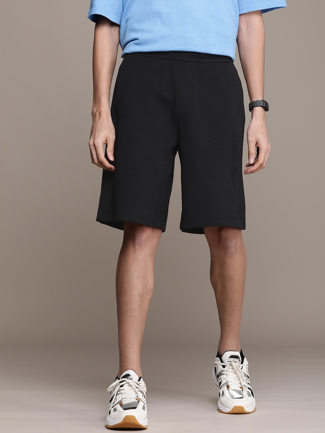 

Calvin Klein Jeans Men Solid Mid Rise Pure Cotton Shorts, Black