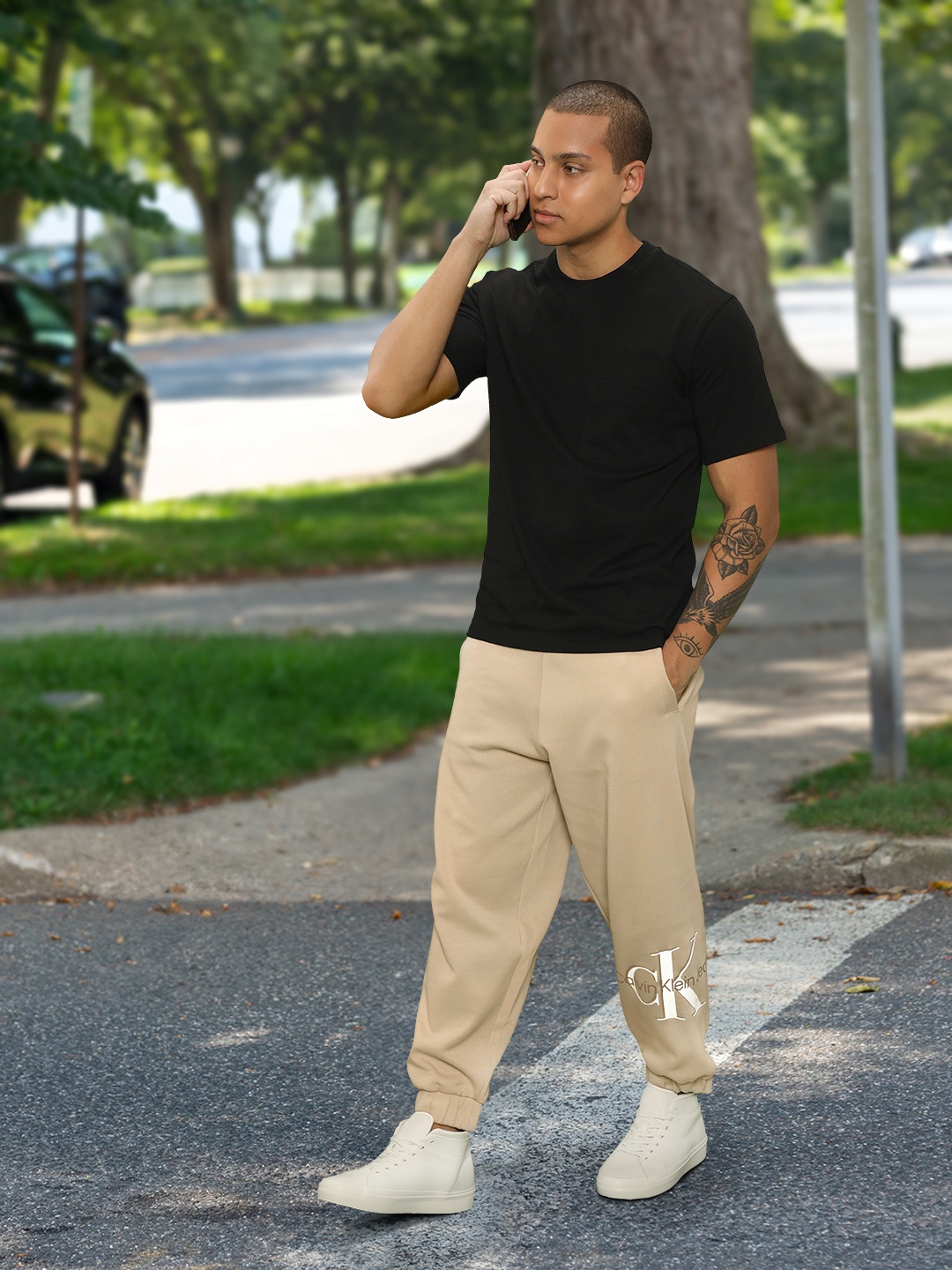 

Calvin Klein Jeans Men Brand Logo Printed Relaxed Fit Joggers With Drawstring Closure, Beige
