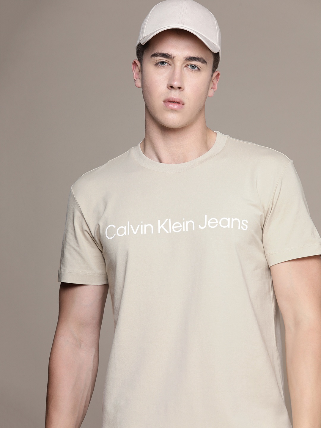 

Calvin Klein Jeans Brand Logo Print Round Neck Knitted T-shirt, Beige