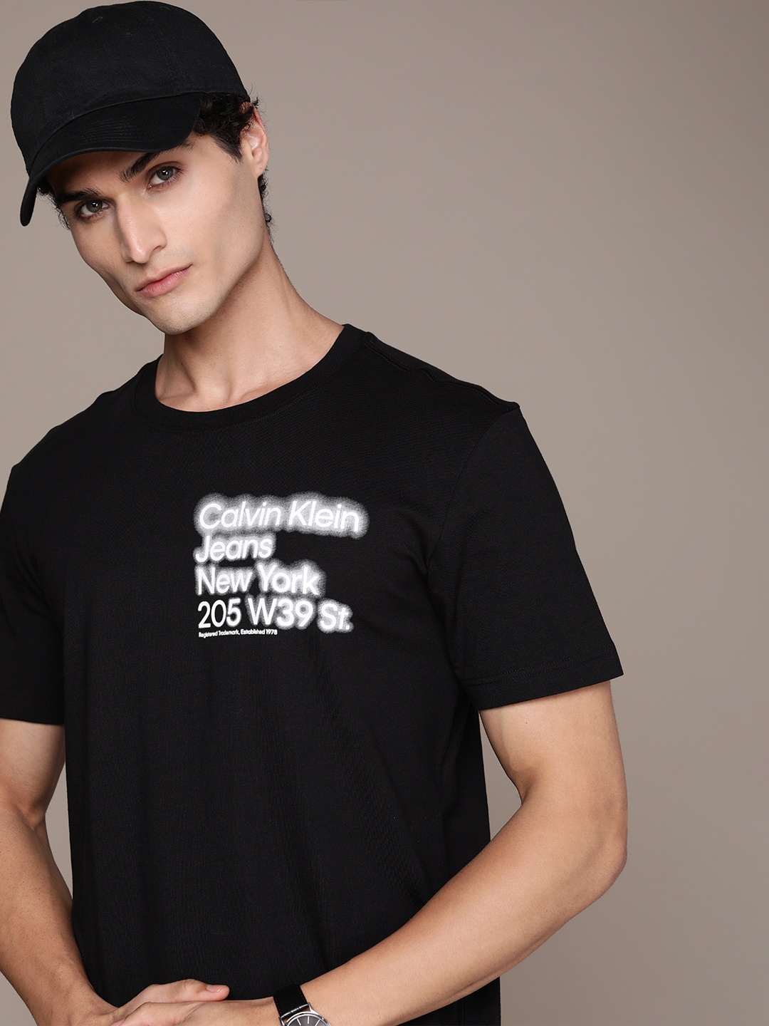 

Calvin Klein Jeans Men Pure Cotton Brand Logo Printed T-shirt, Black