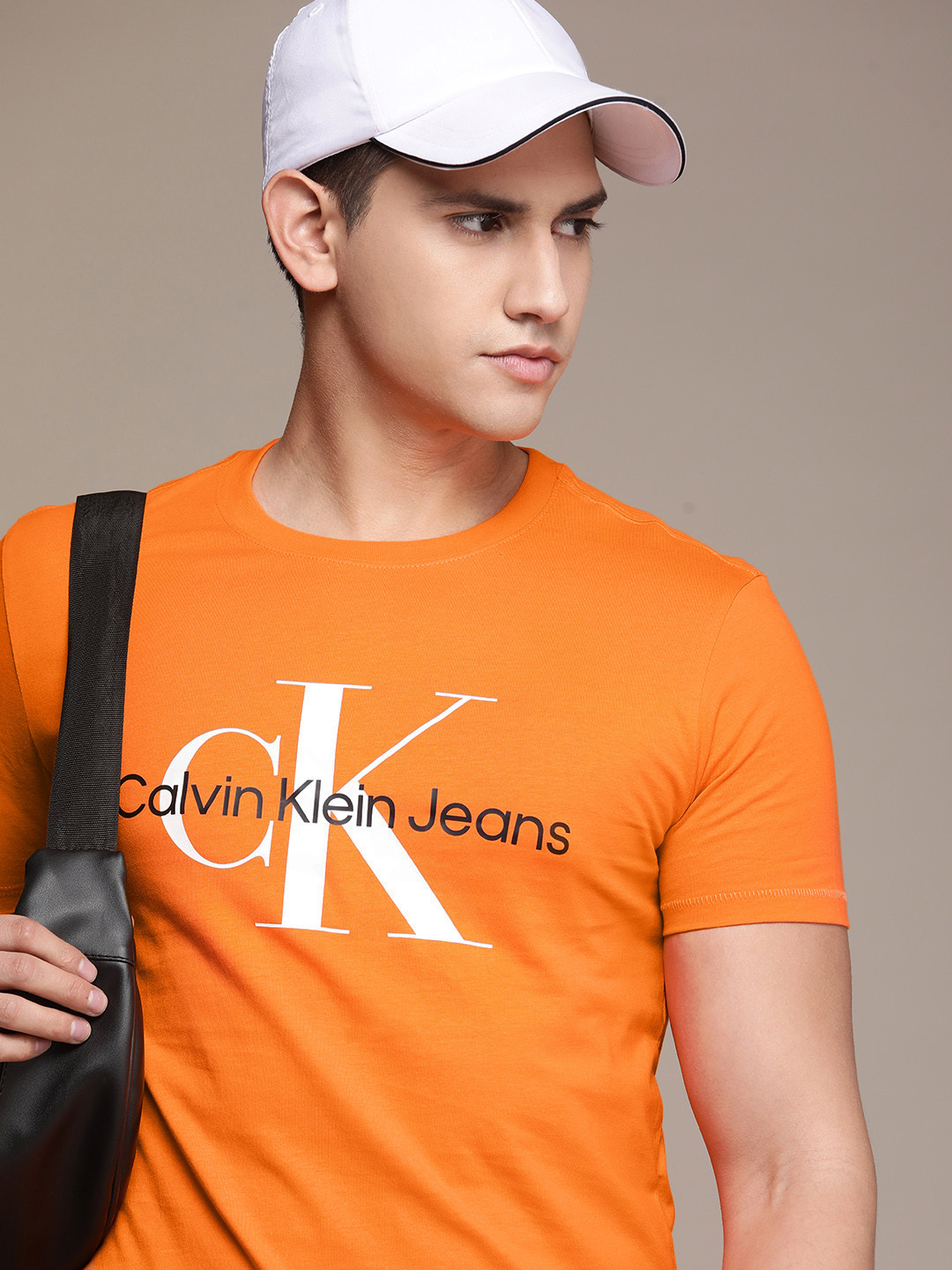 

Calvin Klein Jeans Men Brand Logo Printed Pure Cotton Slim Fit T-shirt, Orange