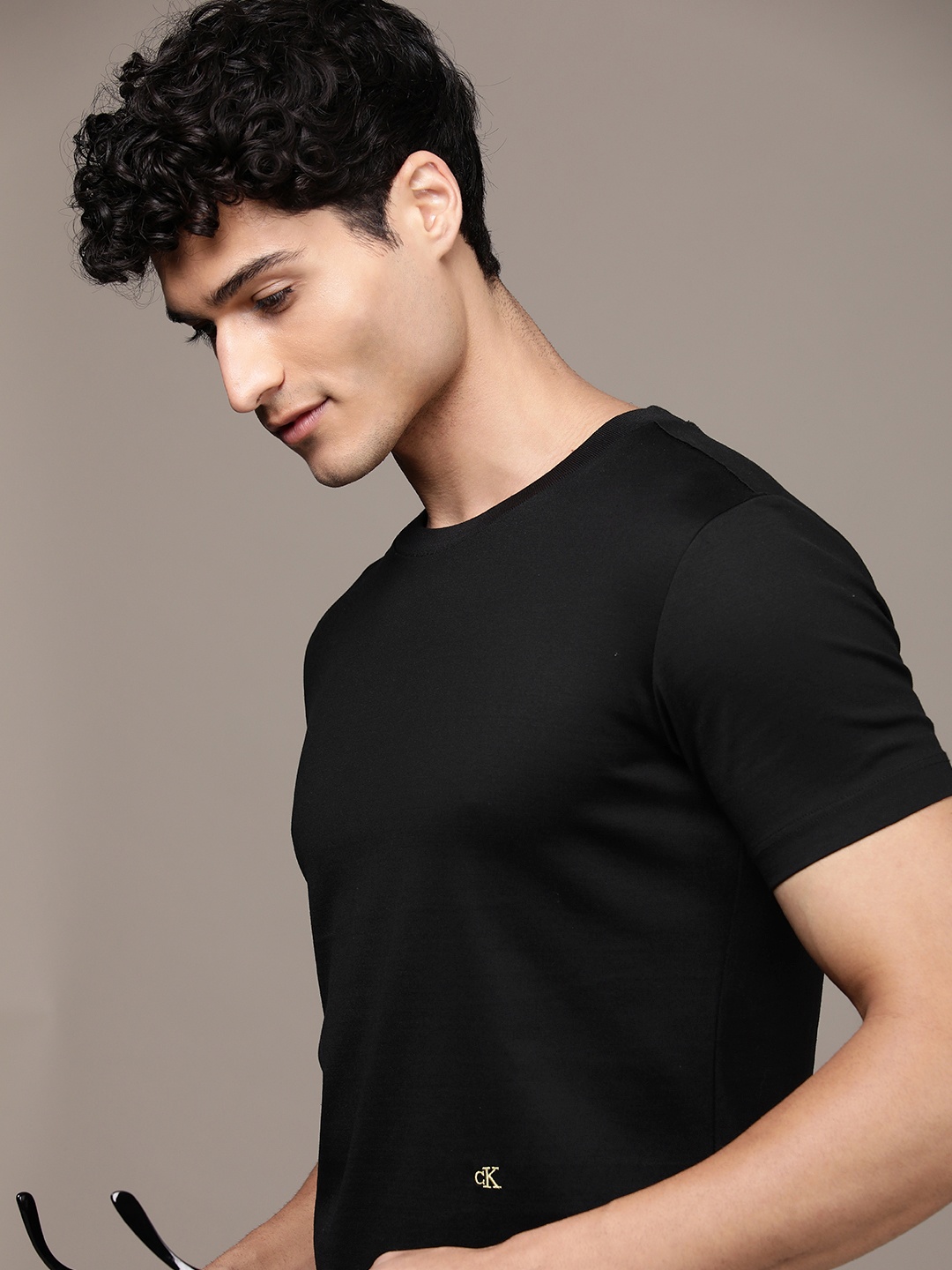 

Calvin Klein Jeans Men Pure Cotton Solid Round Neck Slim Fit T-shirt, Black