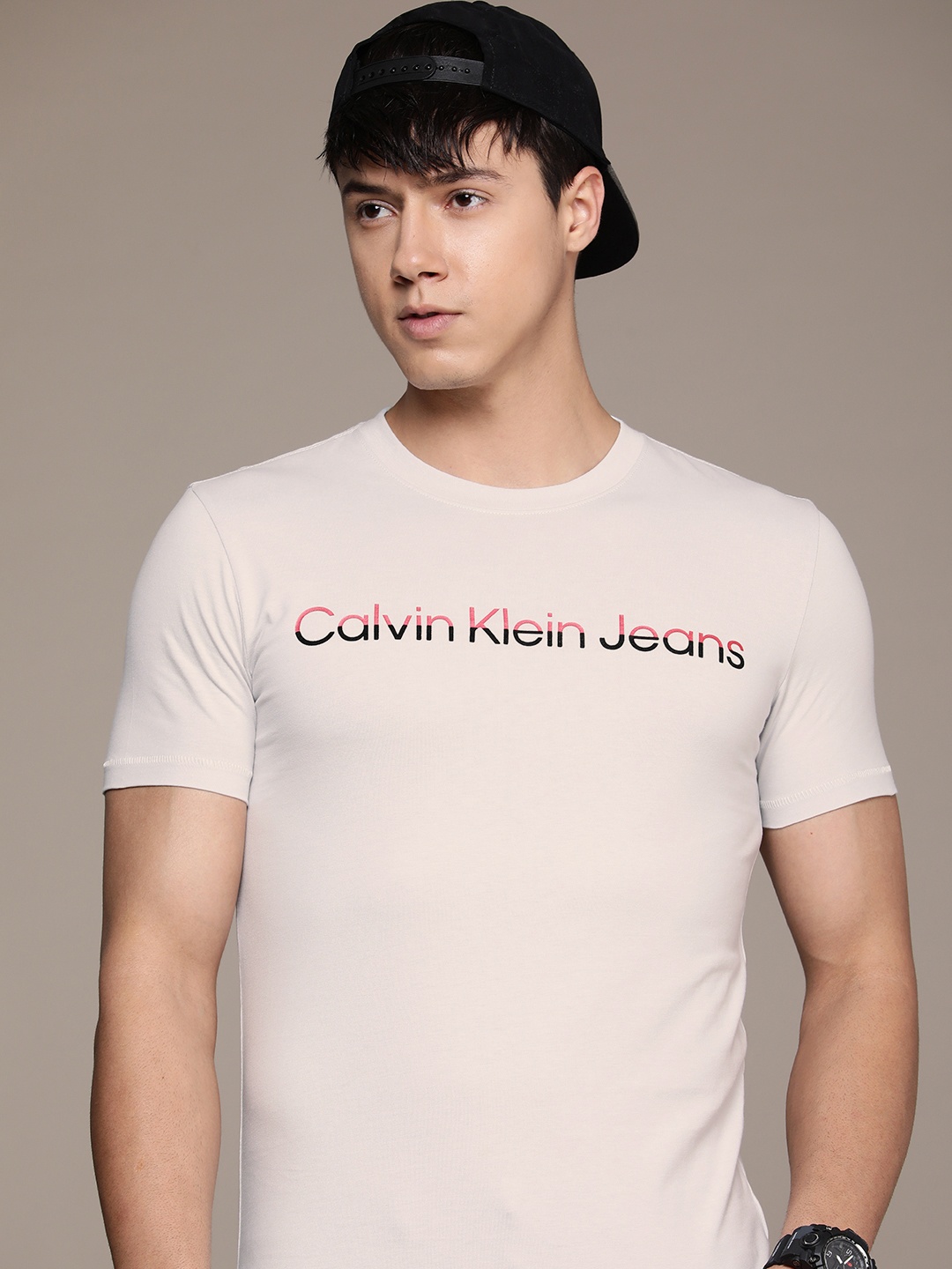 

Calvin Klein Jeans Men Pure Cotton Brand Logo Printed T-shirt, Grey