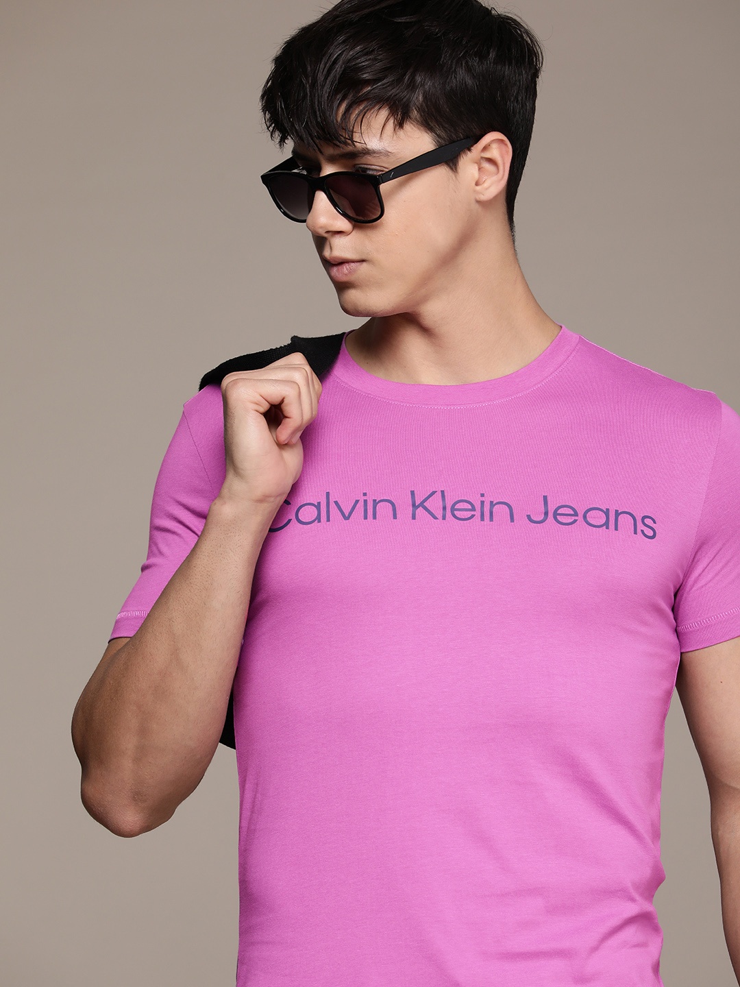 

Calvin Klein Jeans Men Pure Cotton Brand Logo Printed T-shirt, Purple