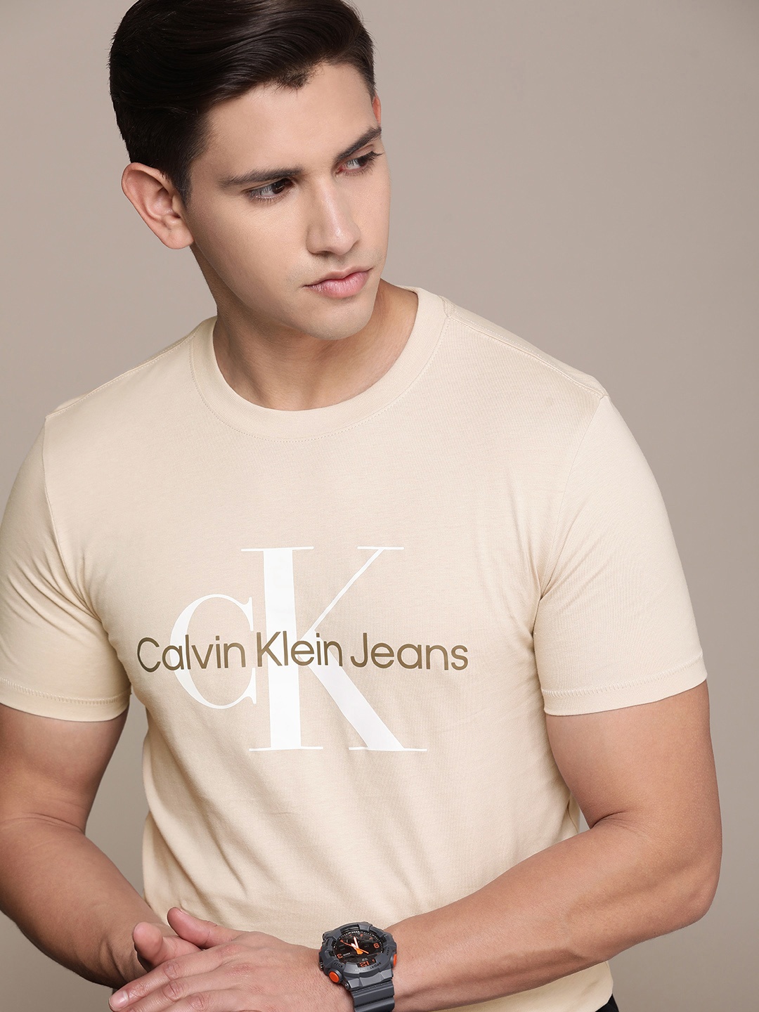 

Calvin Klein Jeans Men Brand Logo Printed Pure Cotton Slim Fit T-shirt, Beige